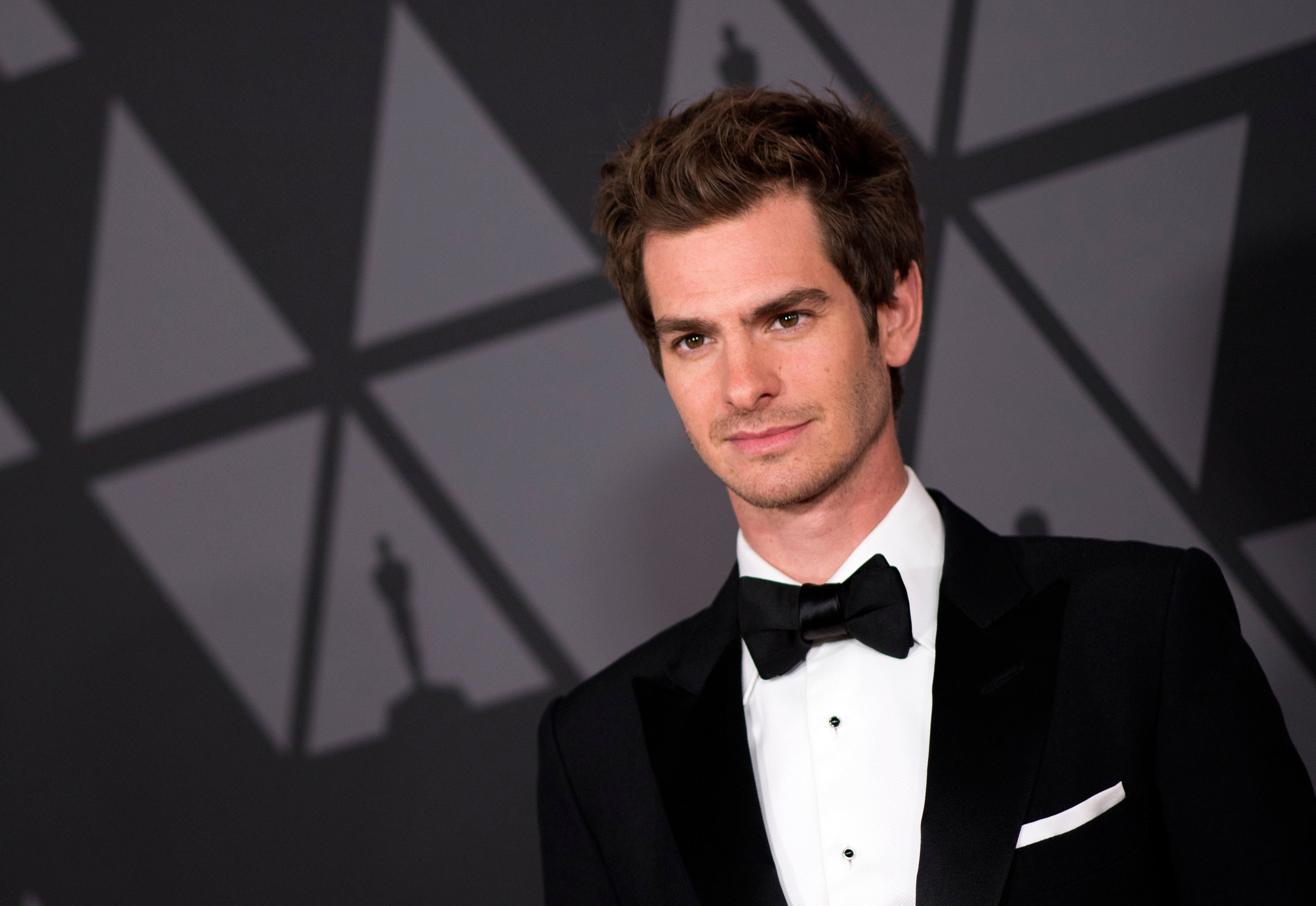 'Spider-Man: No Way Home' star Andrew Garfield wears a black tux with a black bow tie.