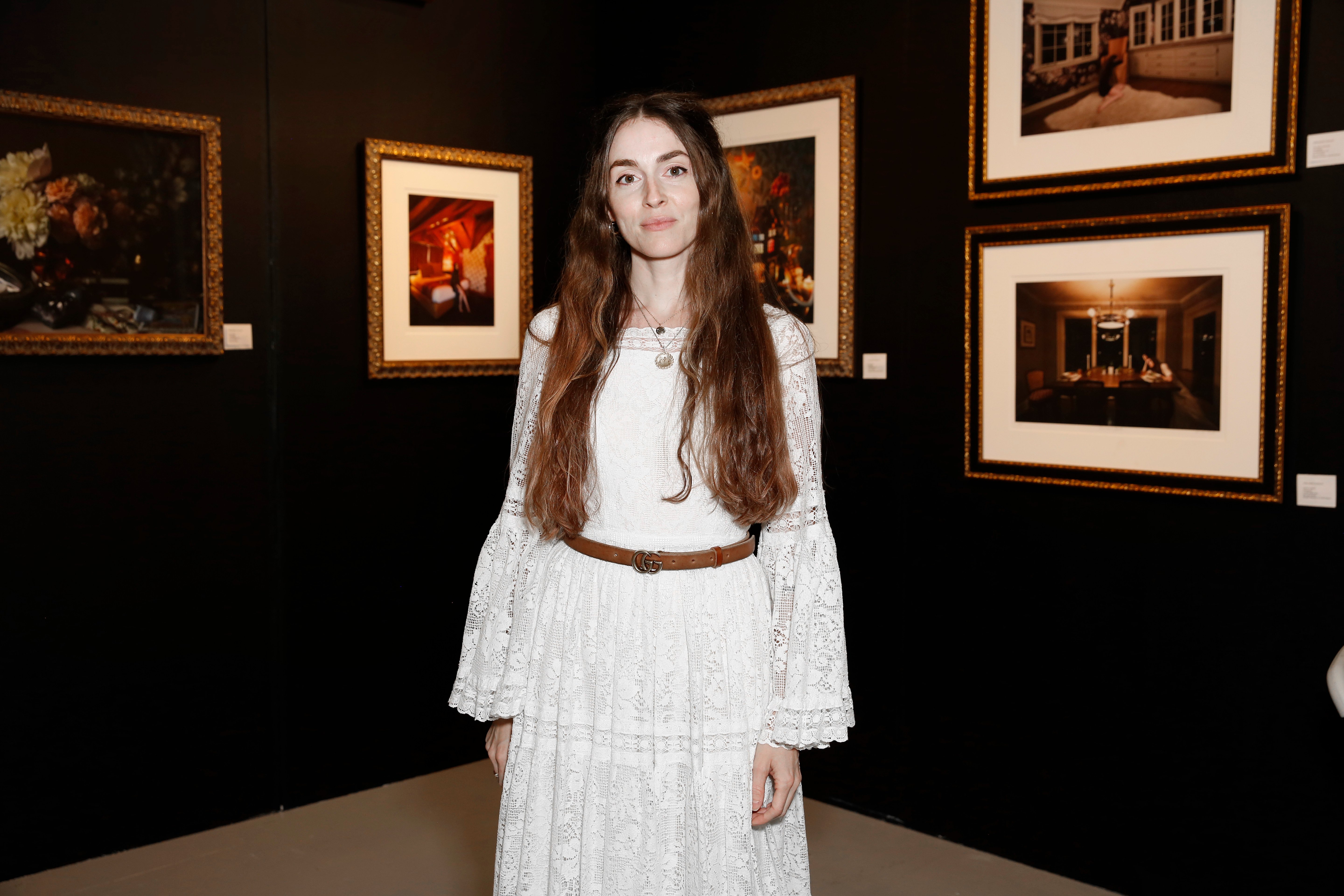 Anna Marie Tendler stands in front of her exhibit at The Other Art Fair Los Angeles in 2021