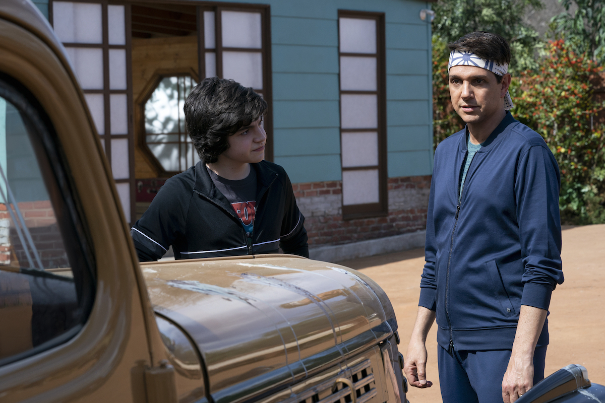 Anthony LaRusso and Daniel LaRusso talk in the driveway in 'Cobra Kai' Season 4
