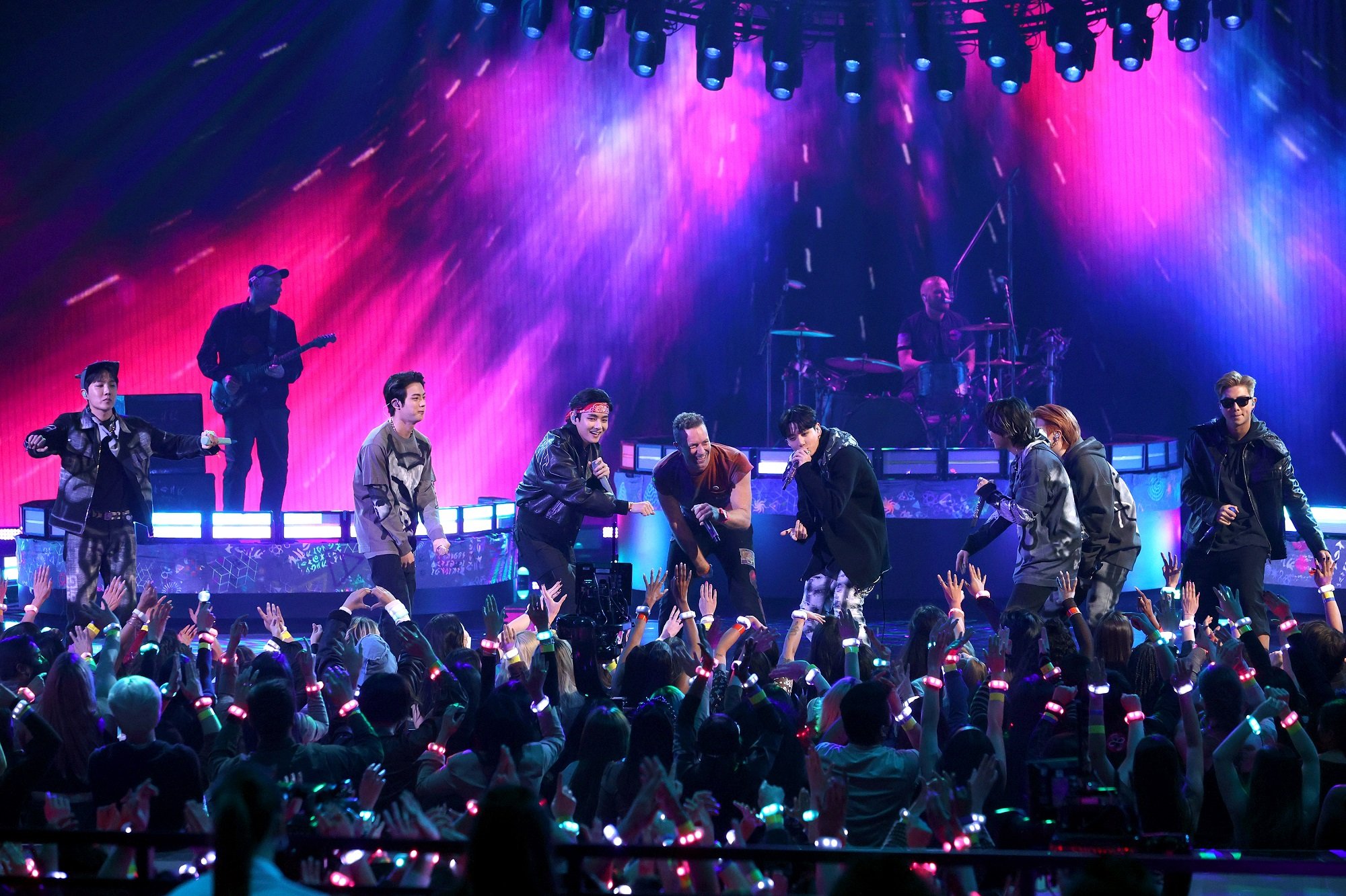 J-Hope, Jin, V, Chris Martin of Coldplay, Jungkook, Jimin, Suga, and RM perform during the 2021 American Music Awards