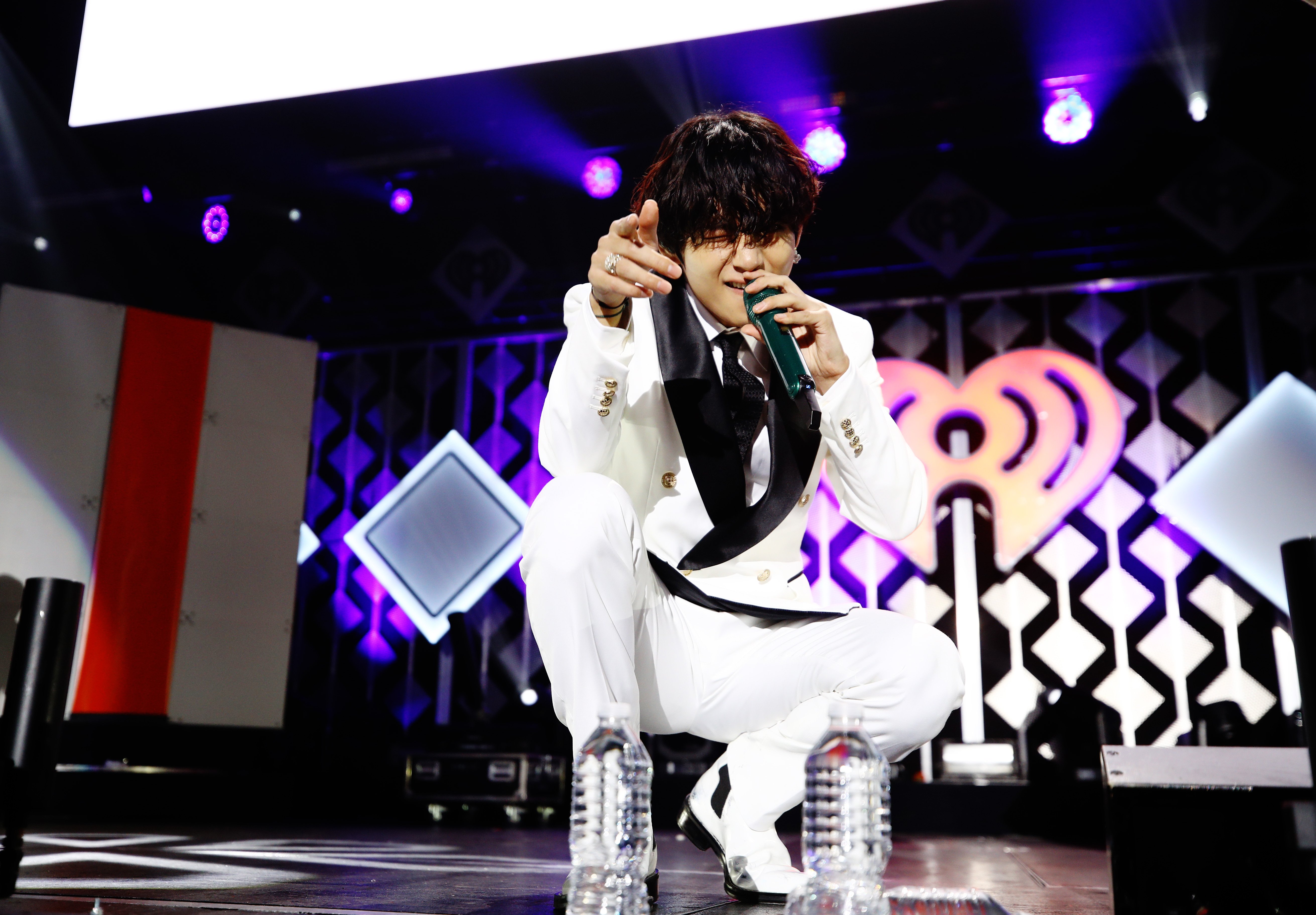 V of BTS performs onstage during 102.7 KIIS FM's Jingle Ball 2019 in white suit