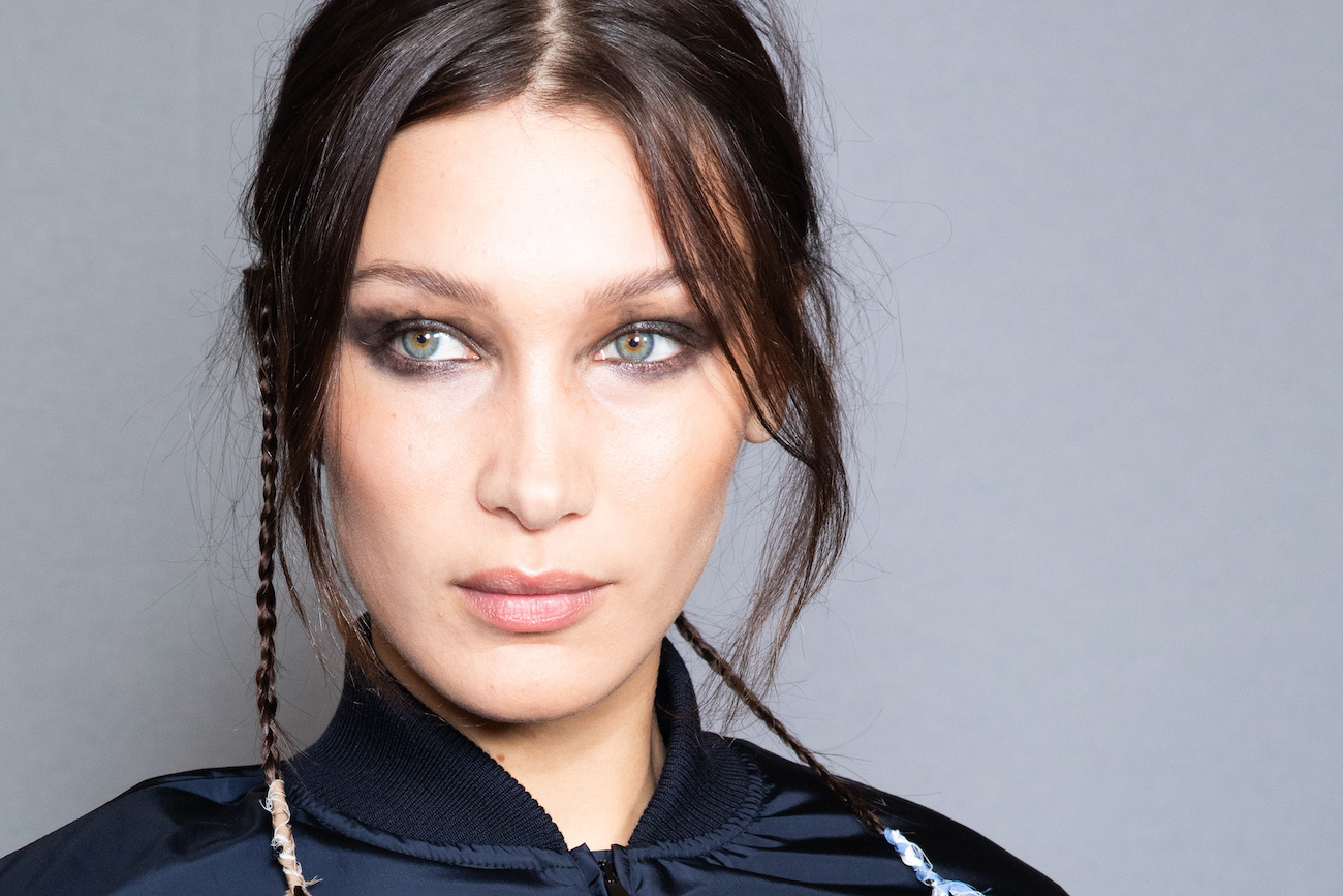 Bella Hadid with an updo, looking off-camera