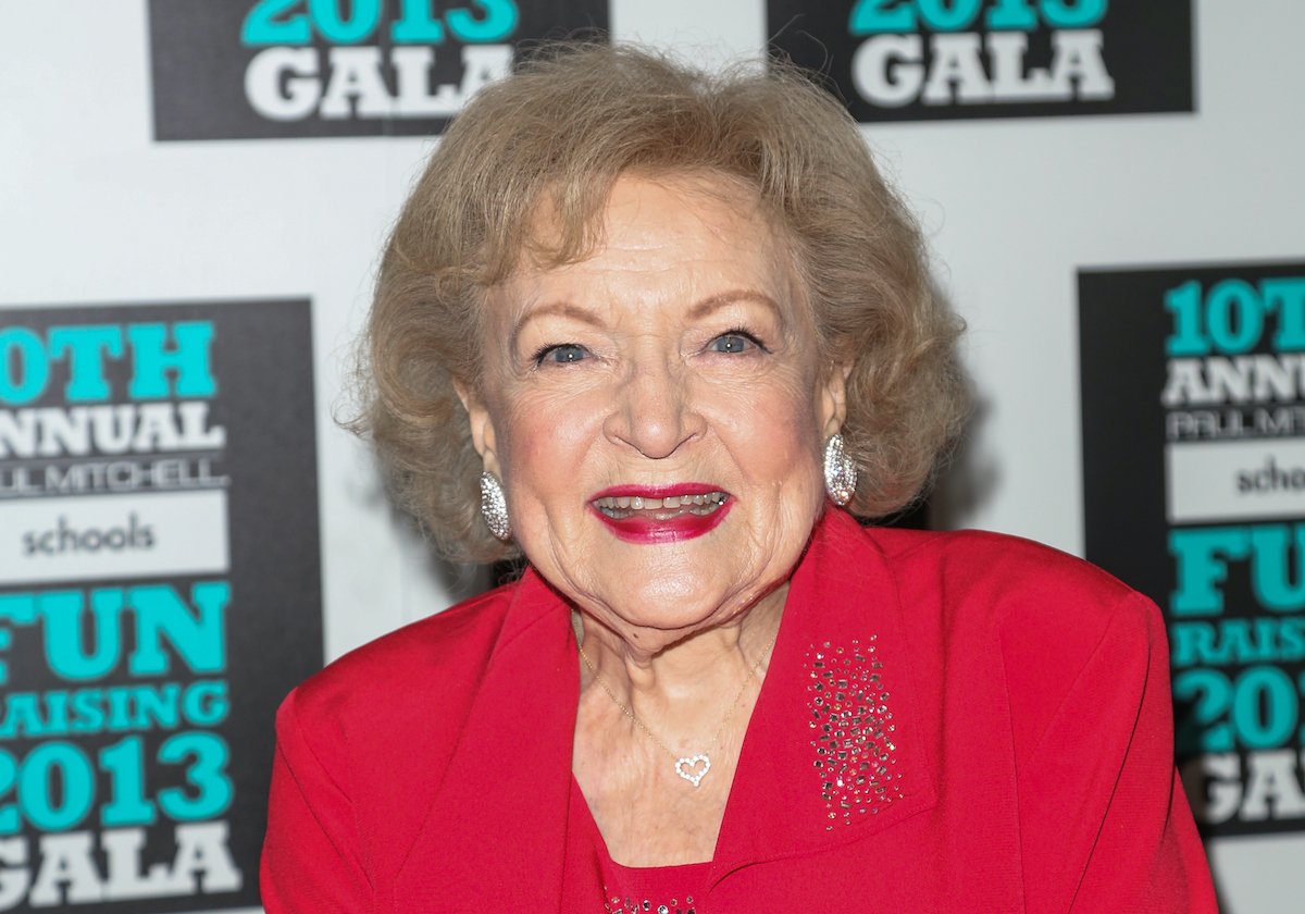 Betty White wears red and smiles