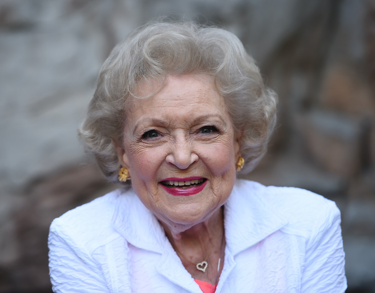 Betty White wears white and smiles