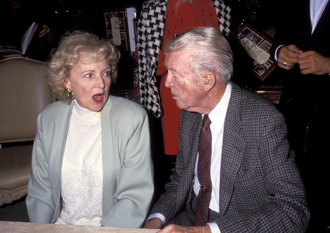 Betty White looks at Jimmy Stewart with her mouth open