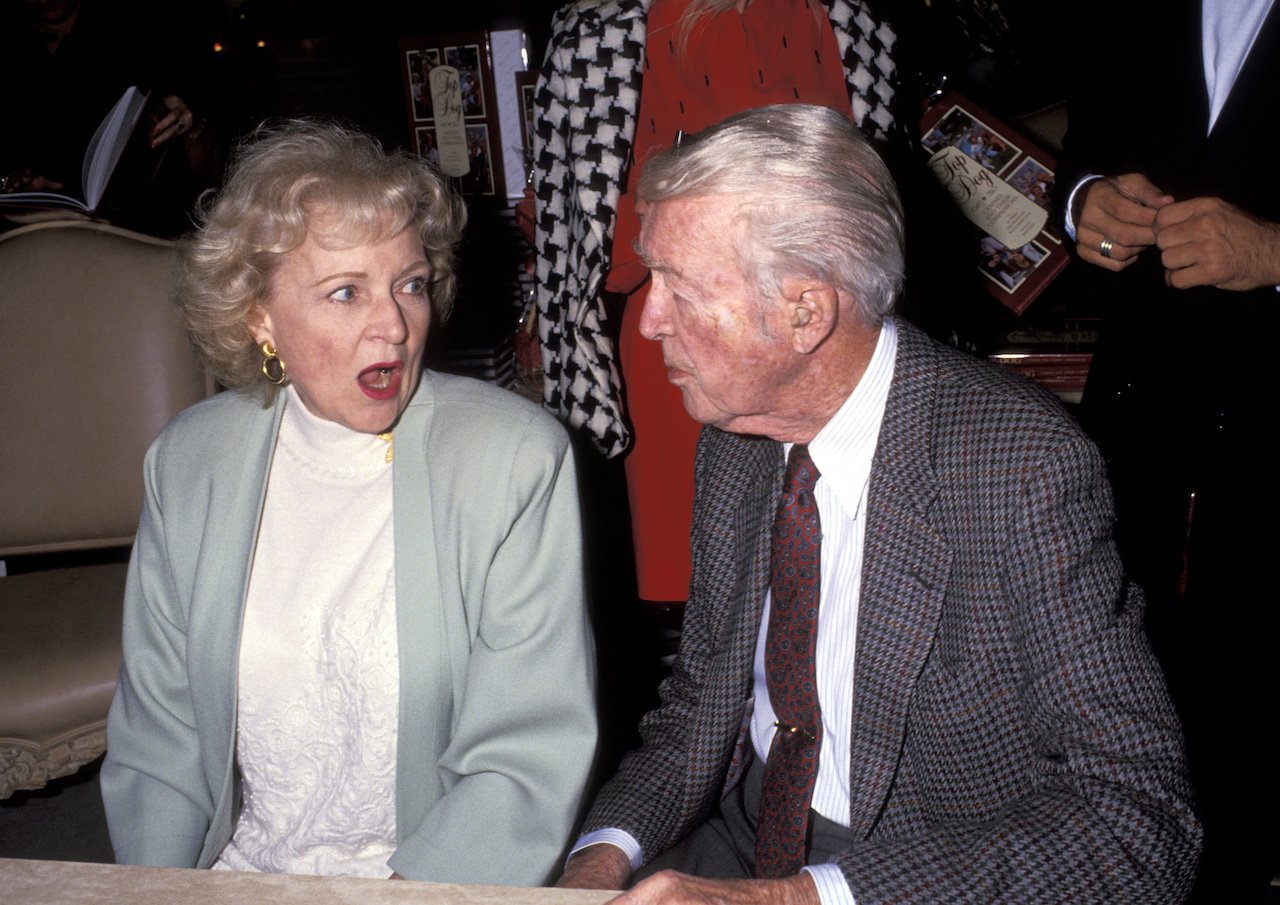 Betty White looks at Jimmy Stewart with her mouth open