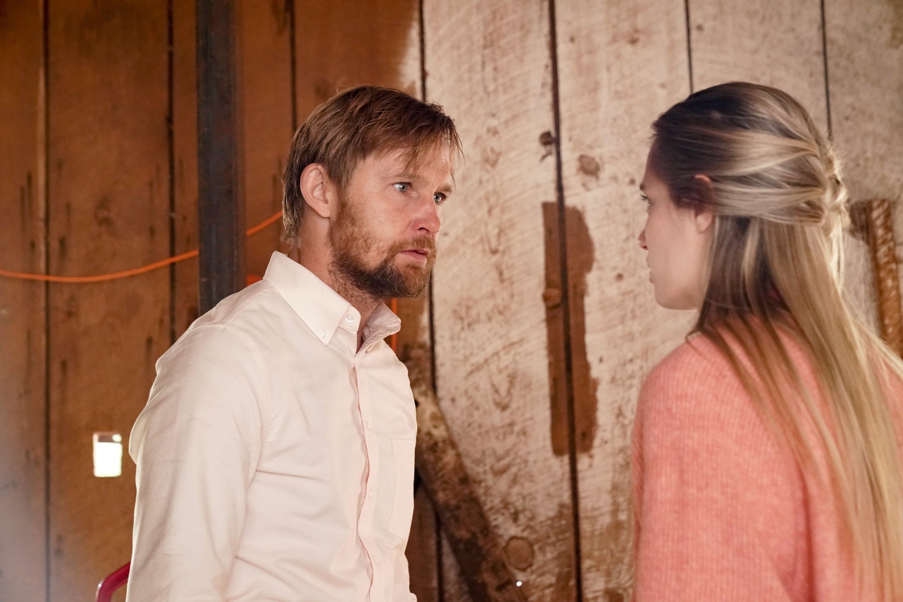 'Big Sky' Season 2 actors Brian Geraghty and Anja Savcic looking at each other