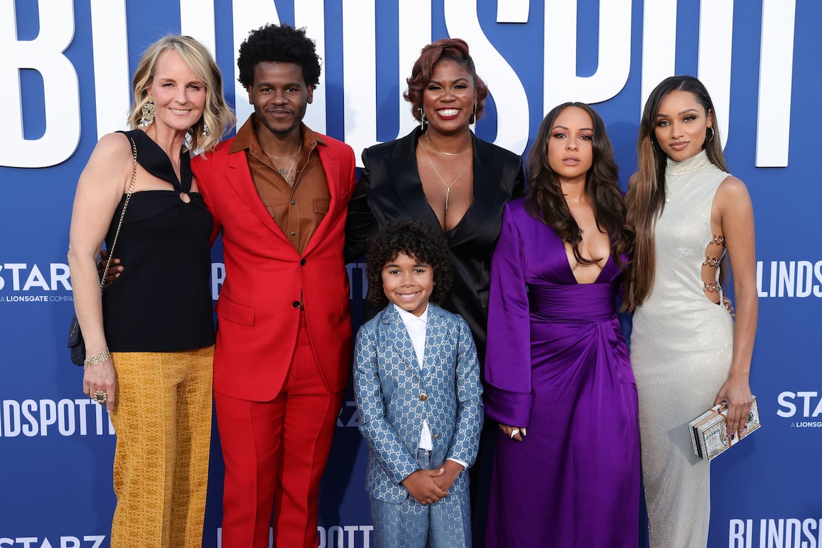 'Blindspotting' cast members smiling in front of a blue background