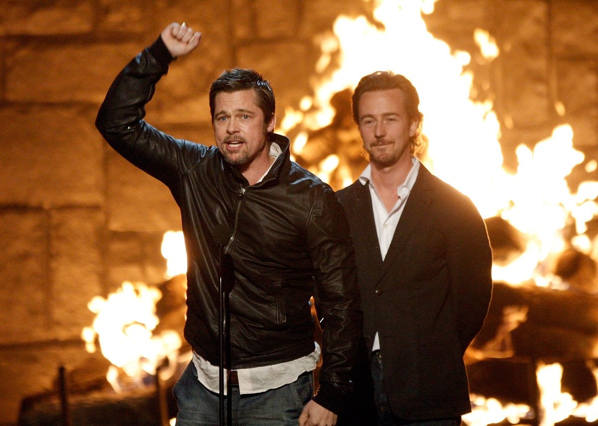 Brad Pitt and Edward Norton posing on stage.