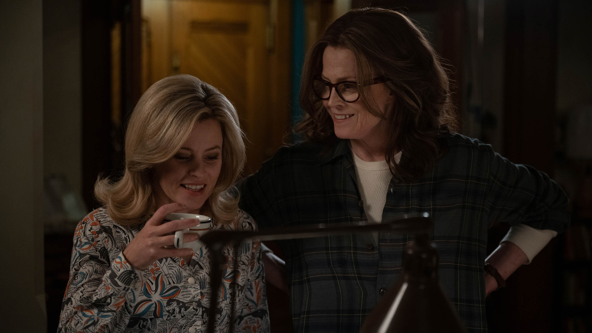 'Call Jane' review Elizabeth Banks as Joy and Sigourney Weaver as Virginia wearing glasses holding a mug