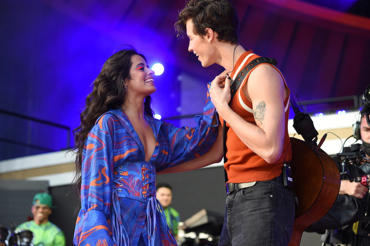 Camila Cabello and Shawn Mendes perform on stage together.