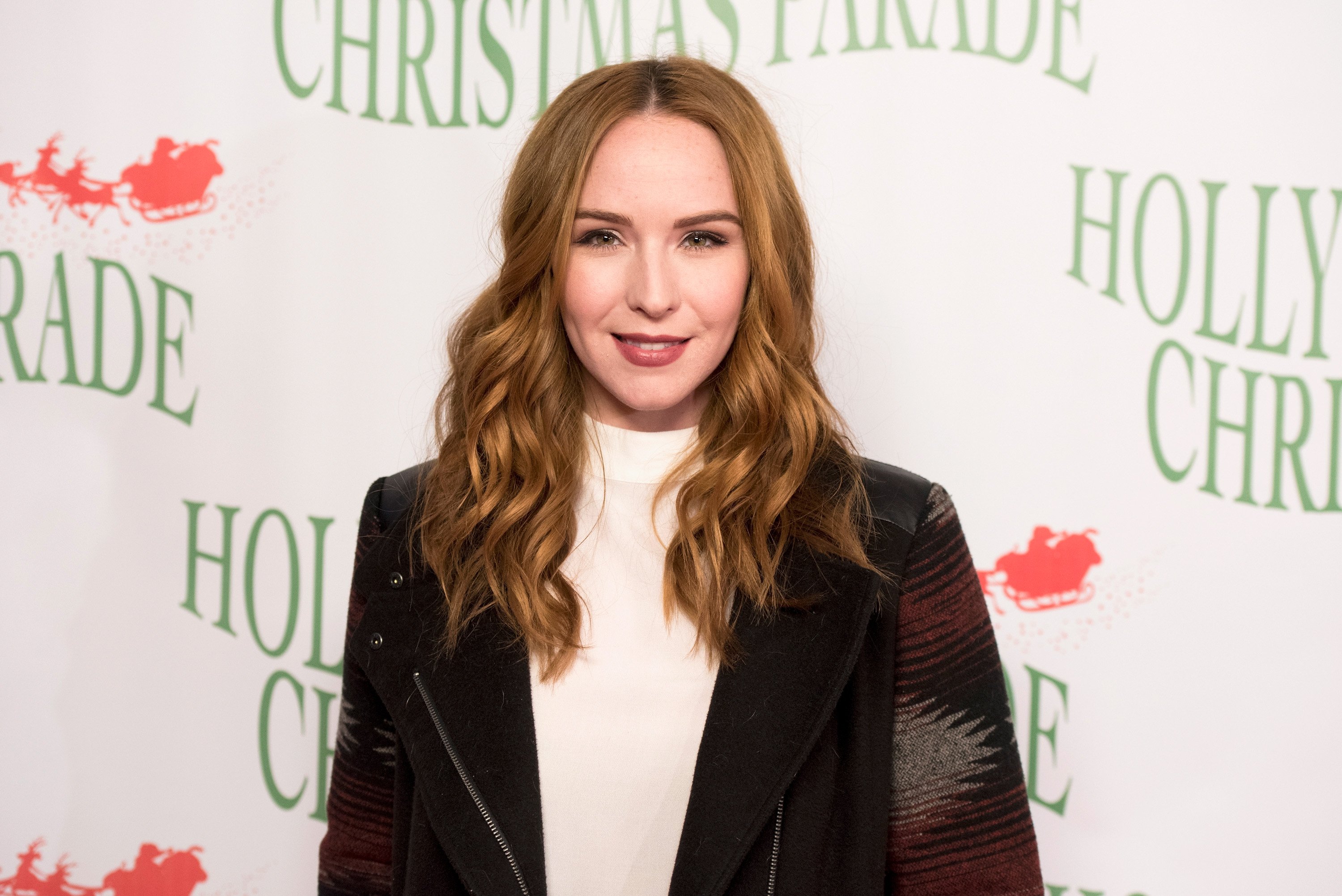 'The Young and the Restless' actor Camryn Grimes wearing a white blouse and black blazer.