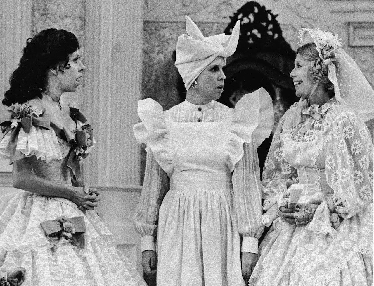 Host Carol Burnett, Vicki Lawrence and guest Dinah Shore wear costumes on stage for a spoof of the film, 'Gone With The Wind,' on the television comedy series, 'The Carol Burnett Show,' 1976.
