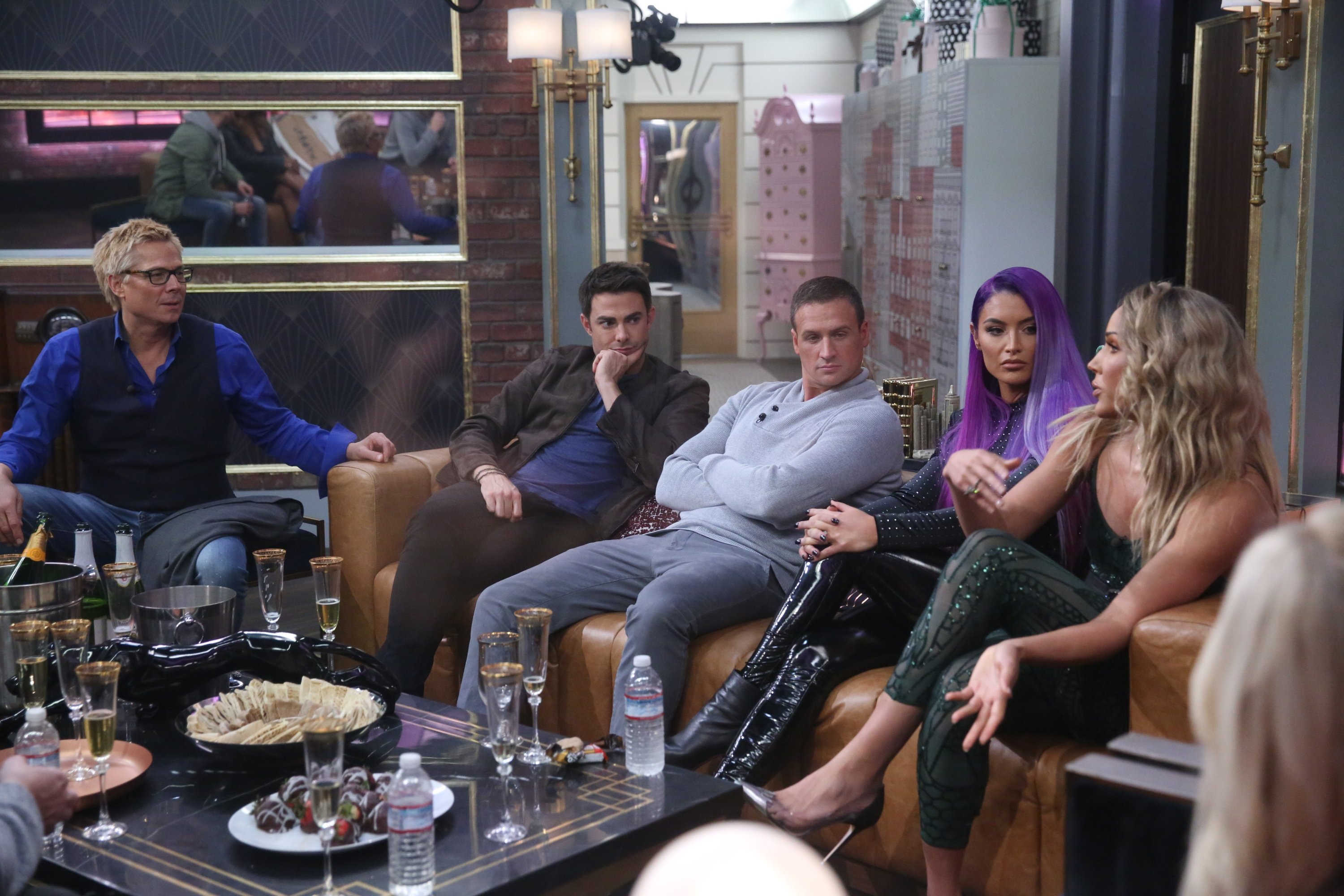 Kato Kaelin, Jonathan Bennett, Ryan Lochte, Natalie Eva Marie, and Lolo Jones sitting on a couch in the living room of 'Celebrity Big Brother'