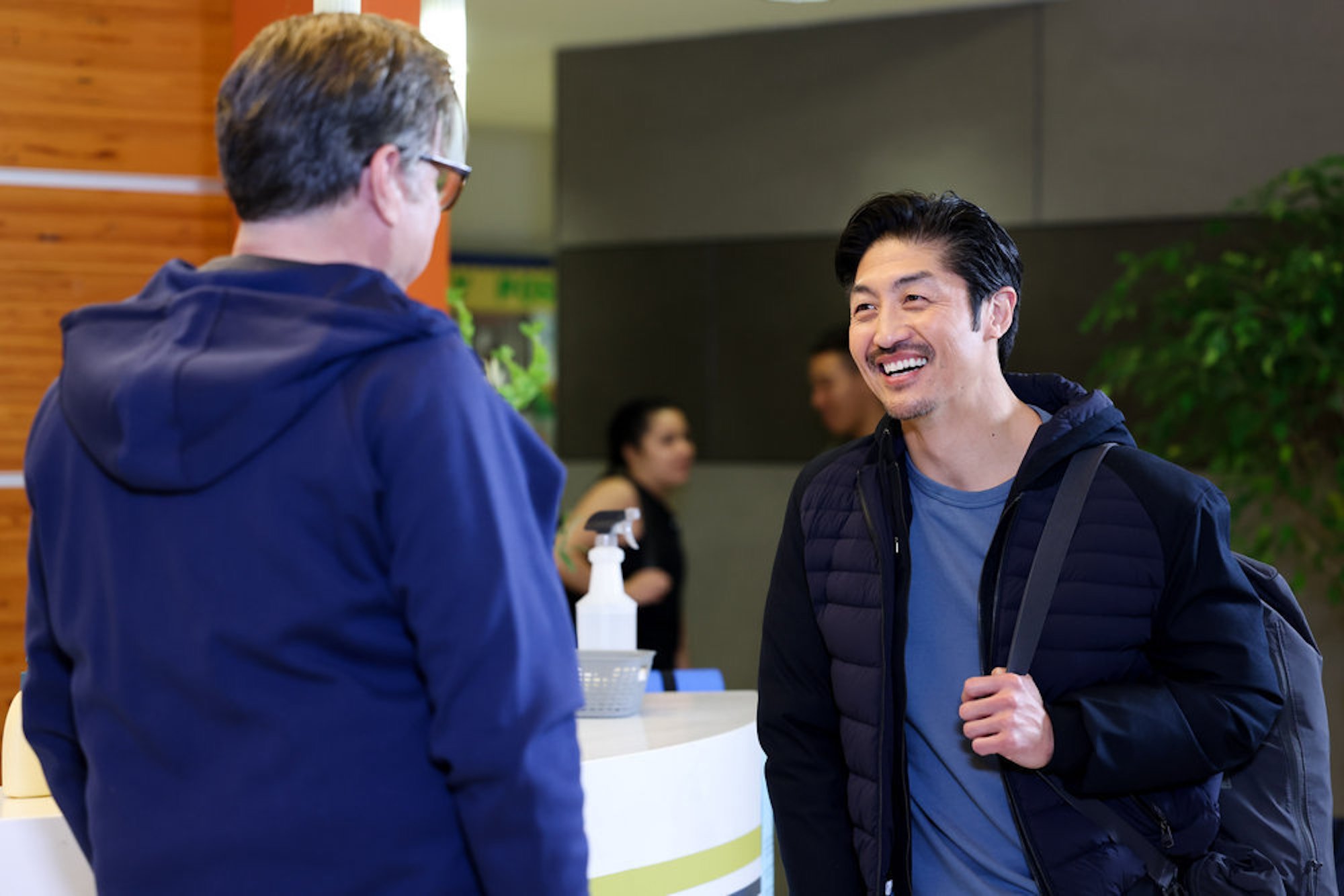 Daniel Charles and Ethan Choi smiling at each other in the hospital in 'Chicago Med' Season 7 Episode 12