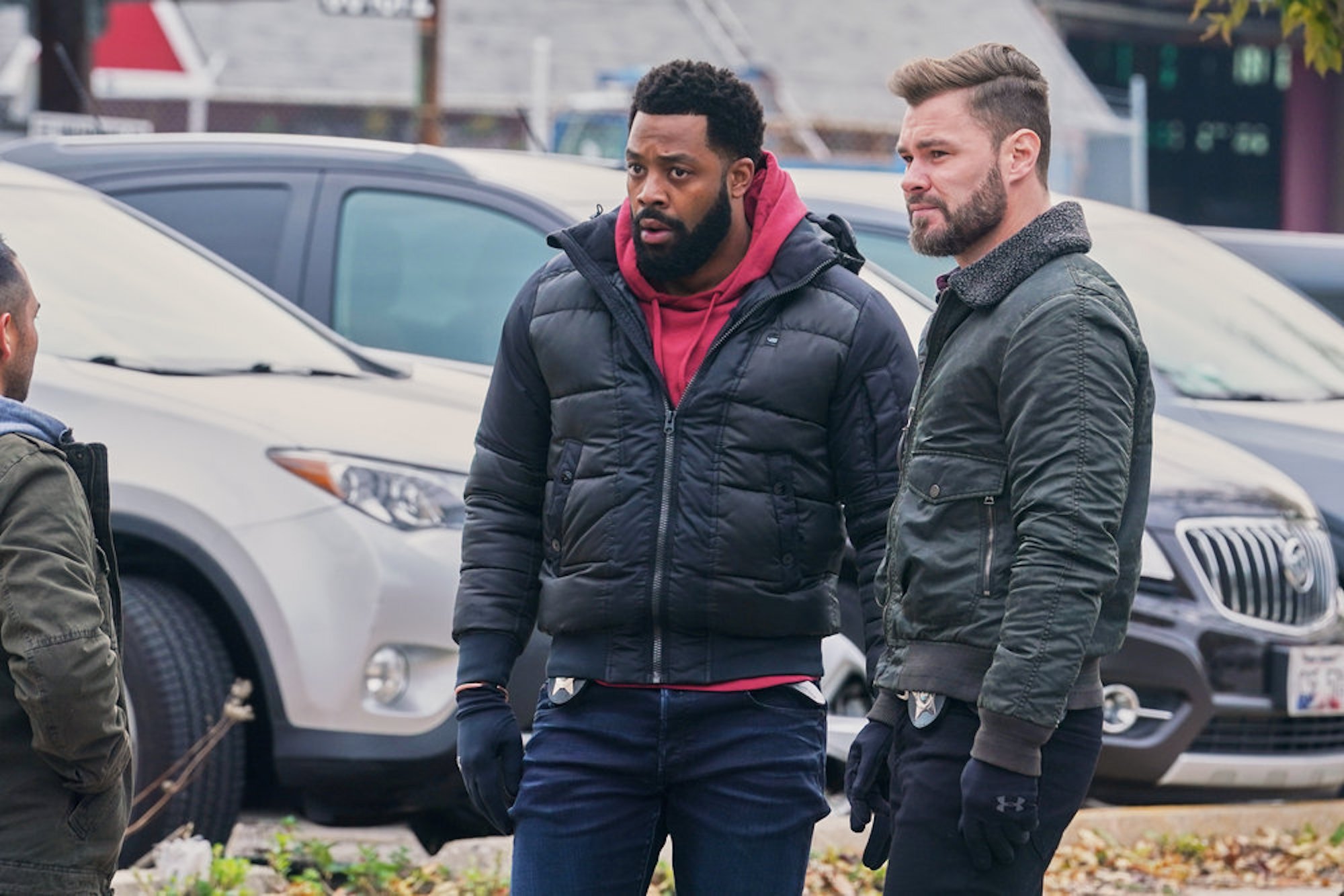 LaRoyce Hawkins as Kevin Atwater and Patrick John Flueger as Adam Ruzek standing outside together in 'Chicago P.D.' Season 9