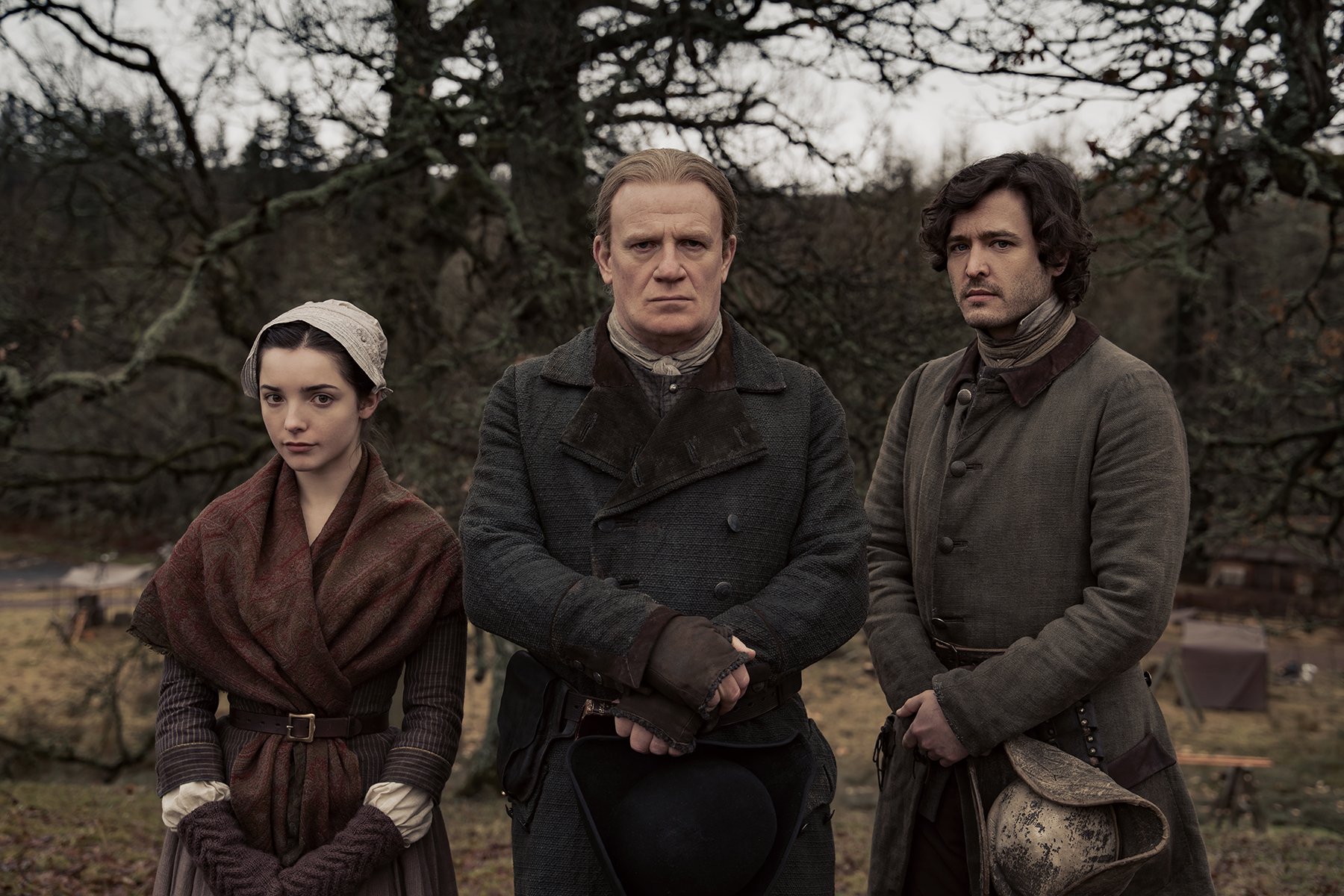 Malva Christie, Tom Christie, and Allan Christie in standing in a row with their arms folded in 'Outlander' Season 6