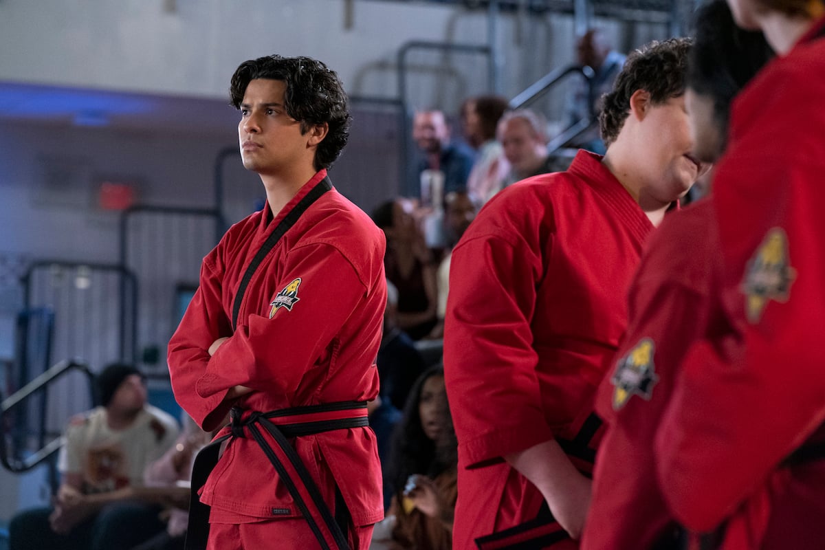'Cobra Kai' Season 5 star Xolo Maridueña folds his arms at the All-Valley Karate Tournament