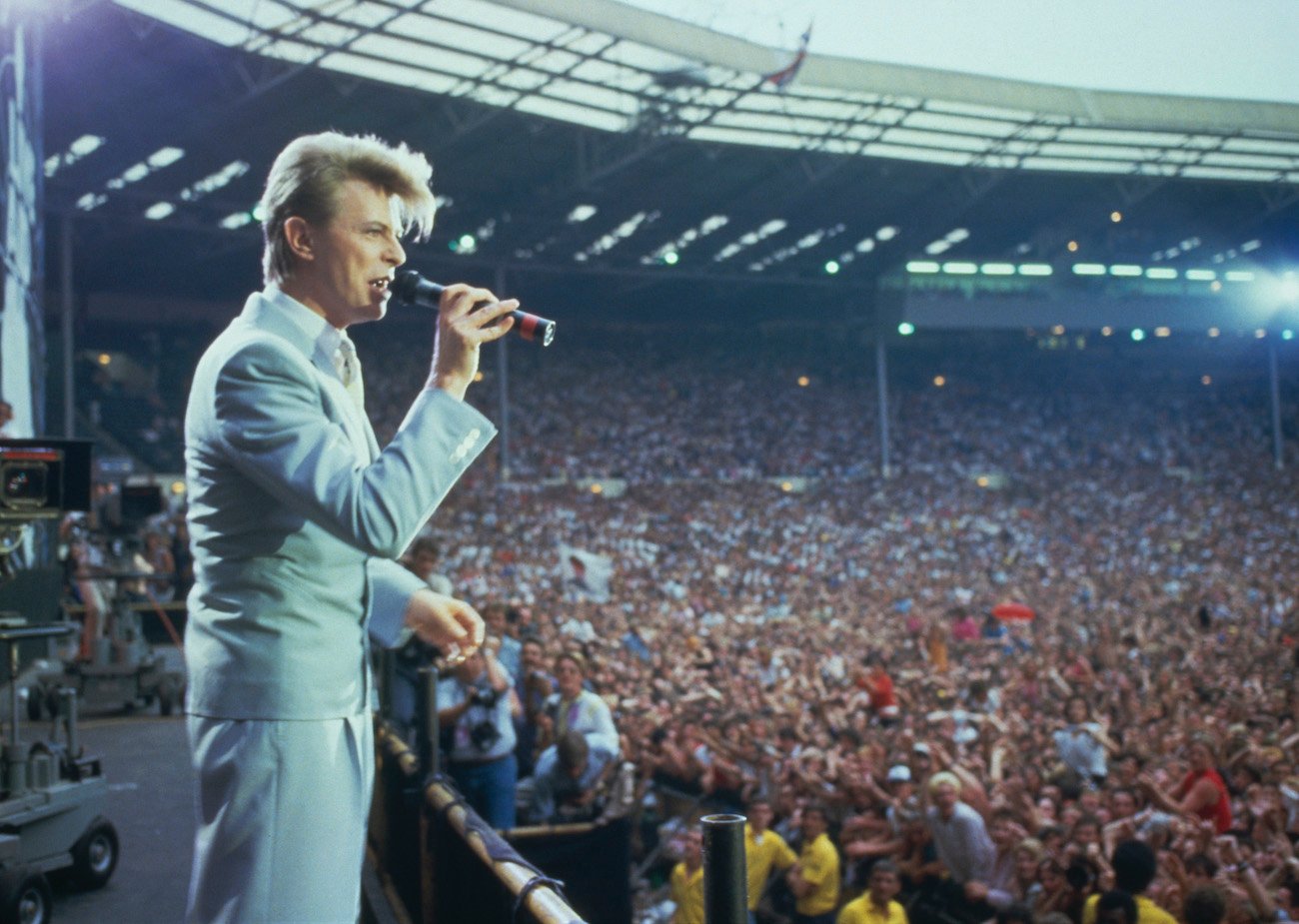 David Bowie performing in a suit at Live Aid, London, 1985.