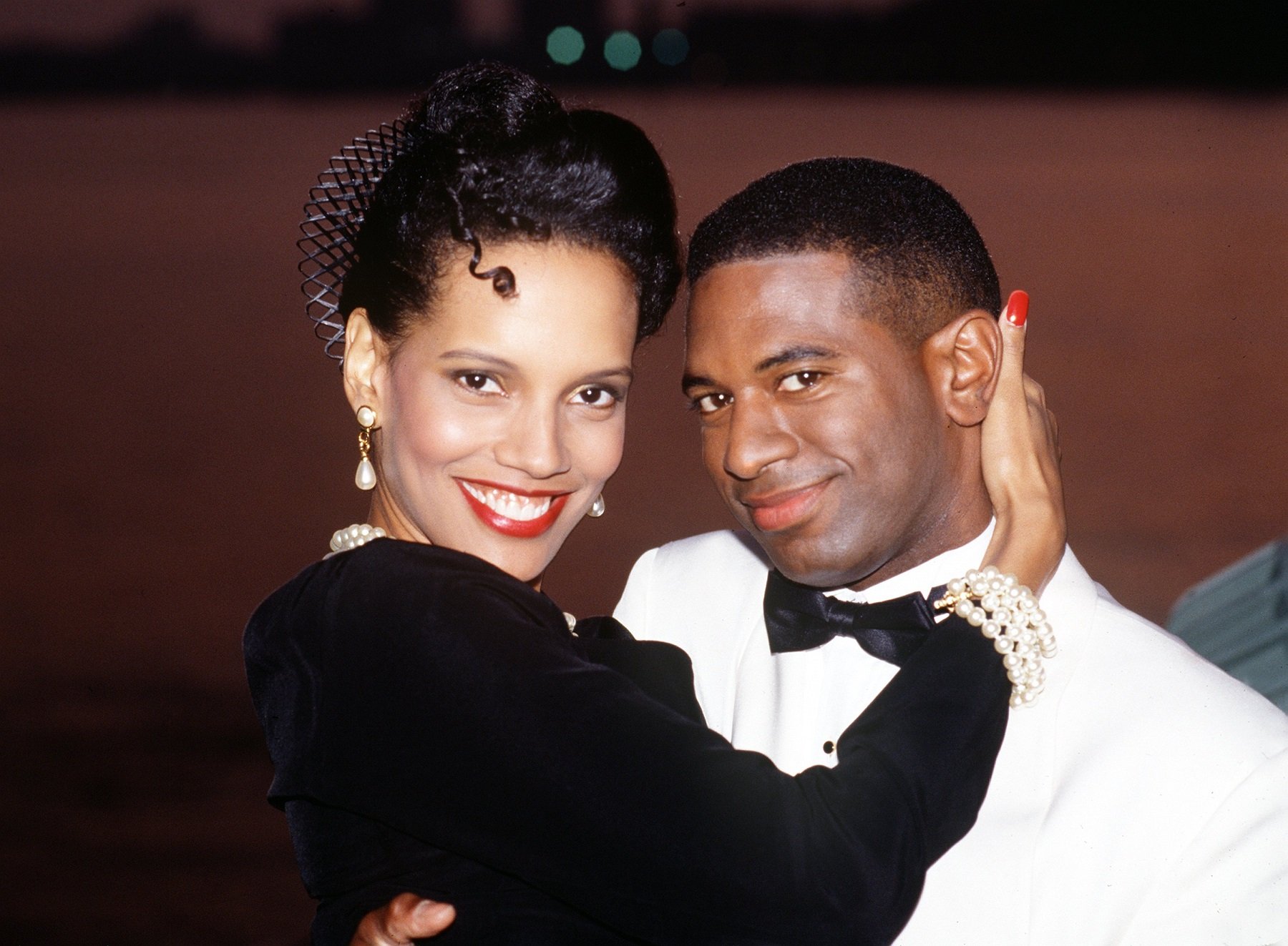 All My Children stars Shari Headly, left, in a black dress, and William Christian, right in a white coat