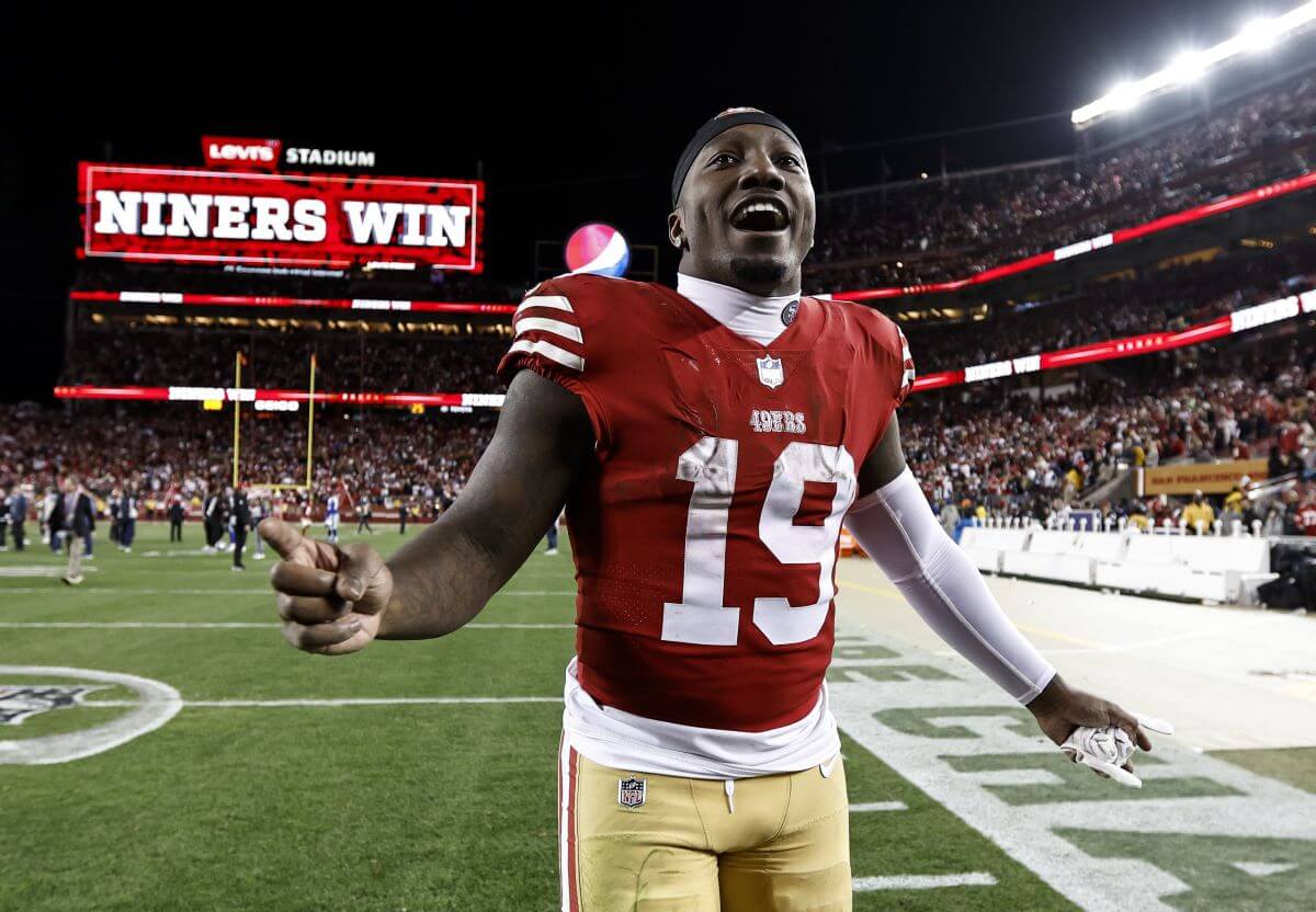 Deebo Samuel of the San Francisco 49ers celebrates after winning a divisional round playoff game