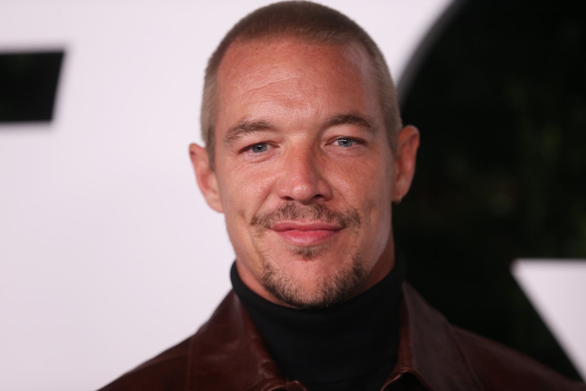 Diplo smiles for the camera at an event.