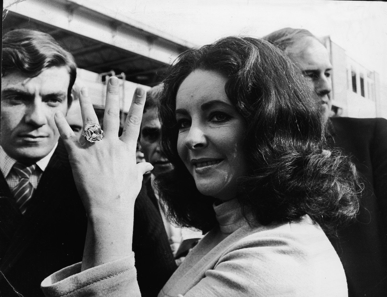Elizabeth Taylor shows off the 33.19 carat diamond ring given to her by husband Richard Burton.