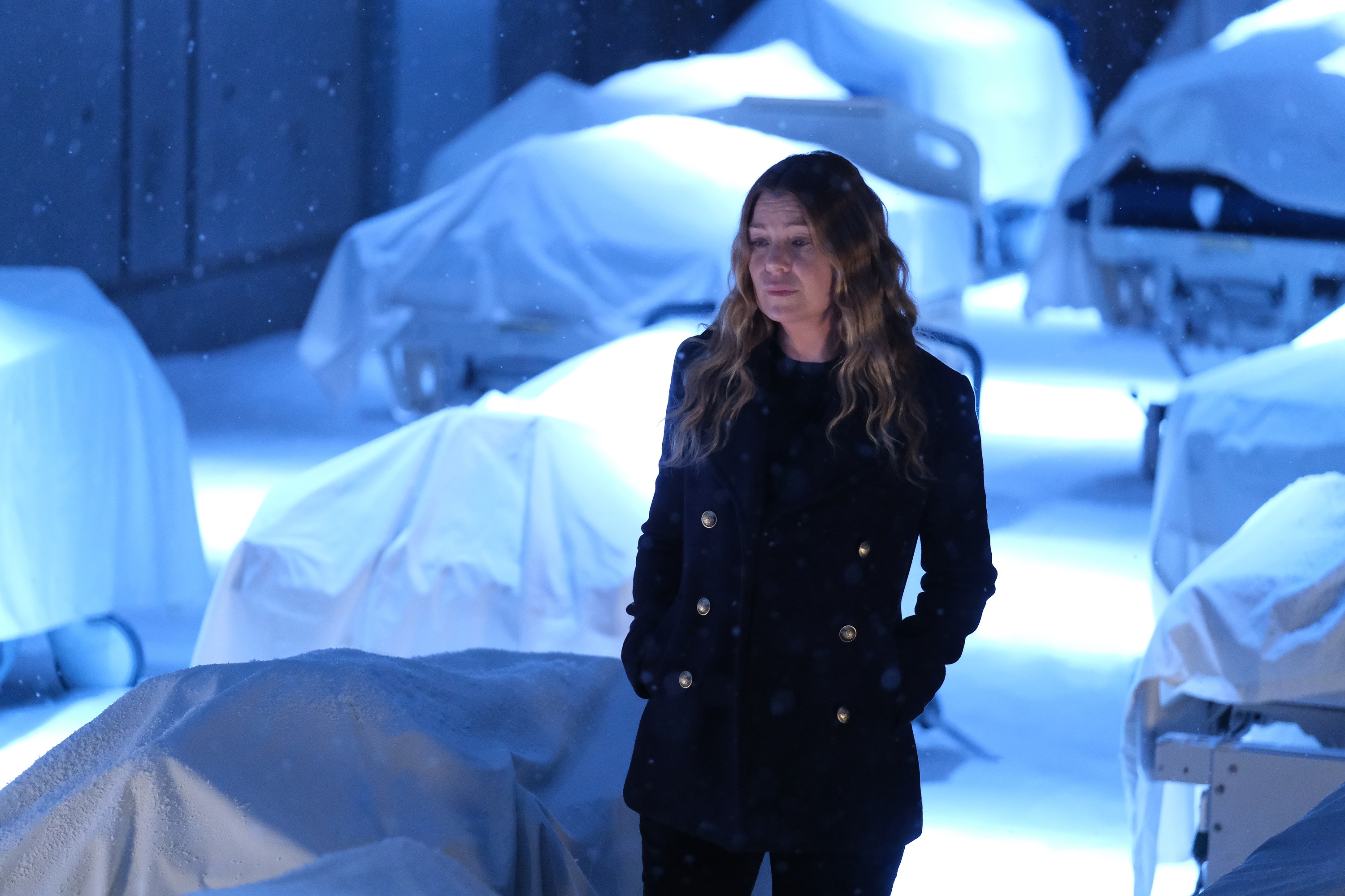 'Grey's Anatomy' star Ellen Pompeo walking through a room of dead bodies