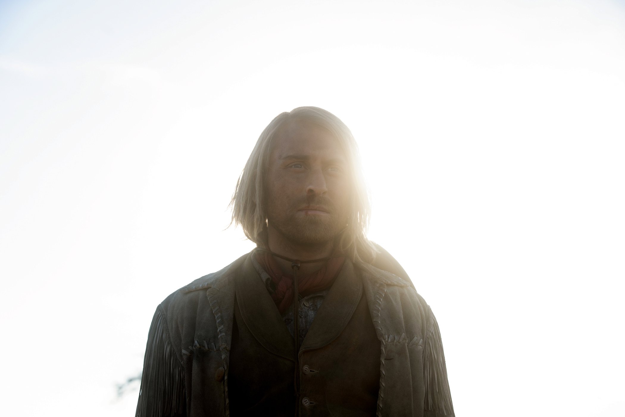 A backlit photo of Eric Nelsen as Ennis in '1883'