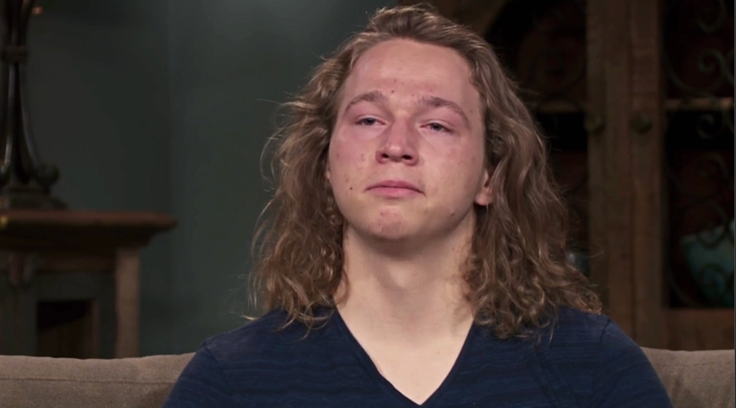Gabriel 'Gabe' Brown crying during a confessional wearing a navy blue shirt on 'Sister Wives.'