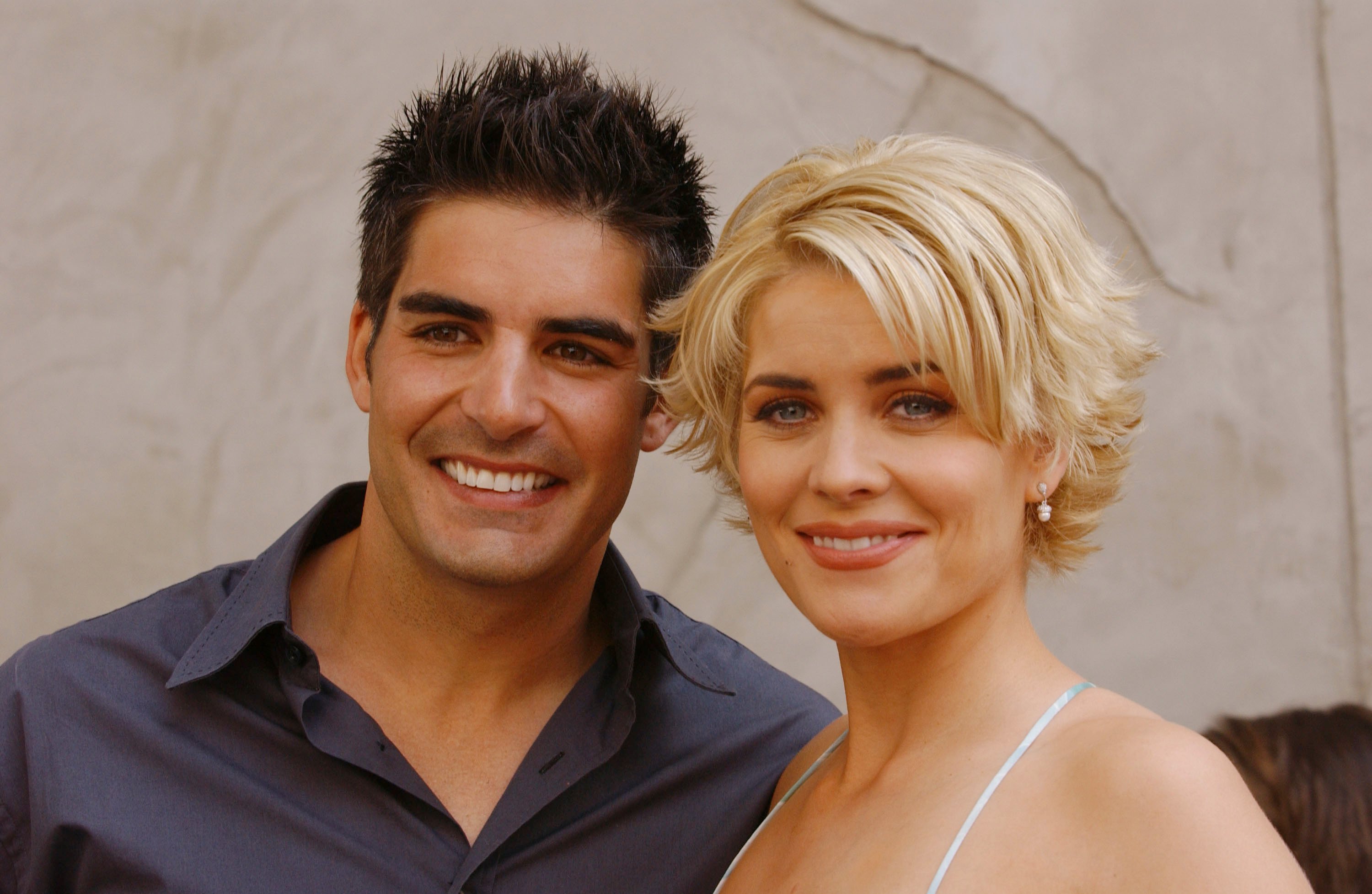 'Passions' actor Galen Gering in a blue shirt, and McKenzie Westmore in a white dress; pose together for a picture.