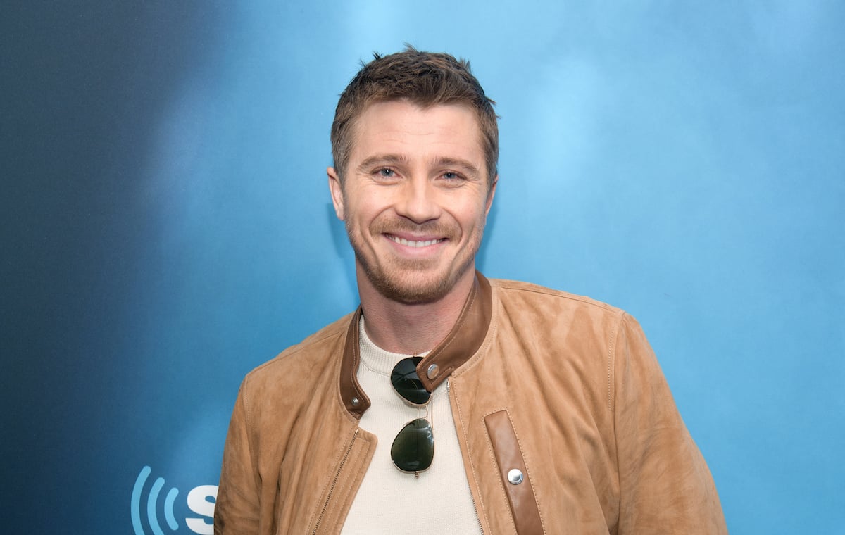 Garrett Hedlund poses at an event.