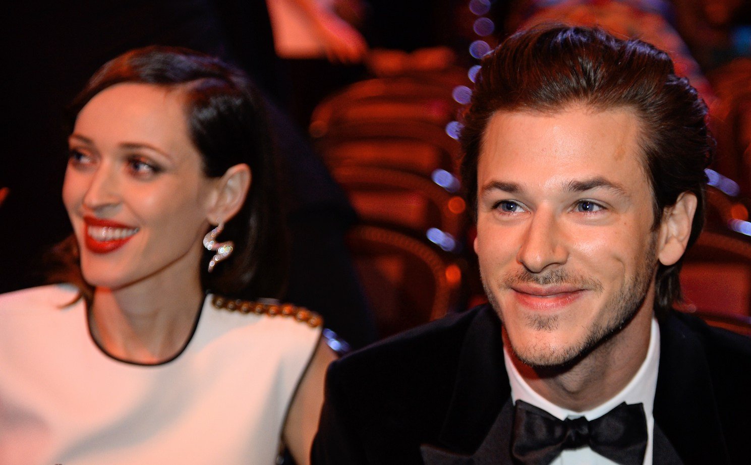 Gaspard Ulliel (R) and partner Gaëlle Piétri sitting next to each other at an awards show
