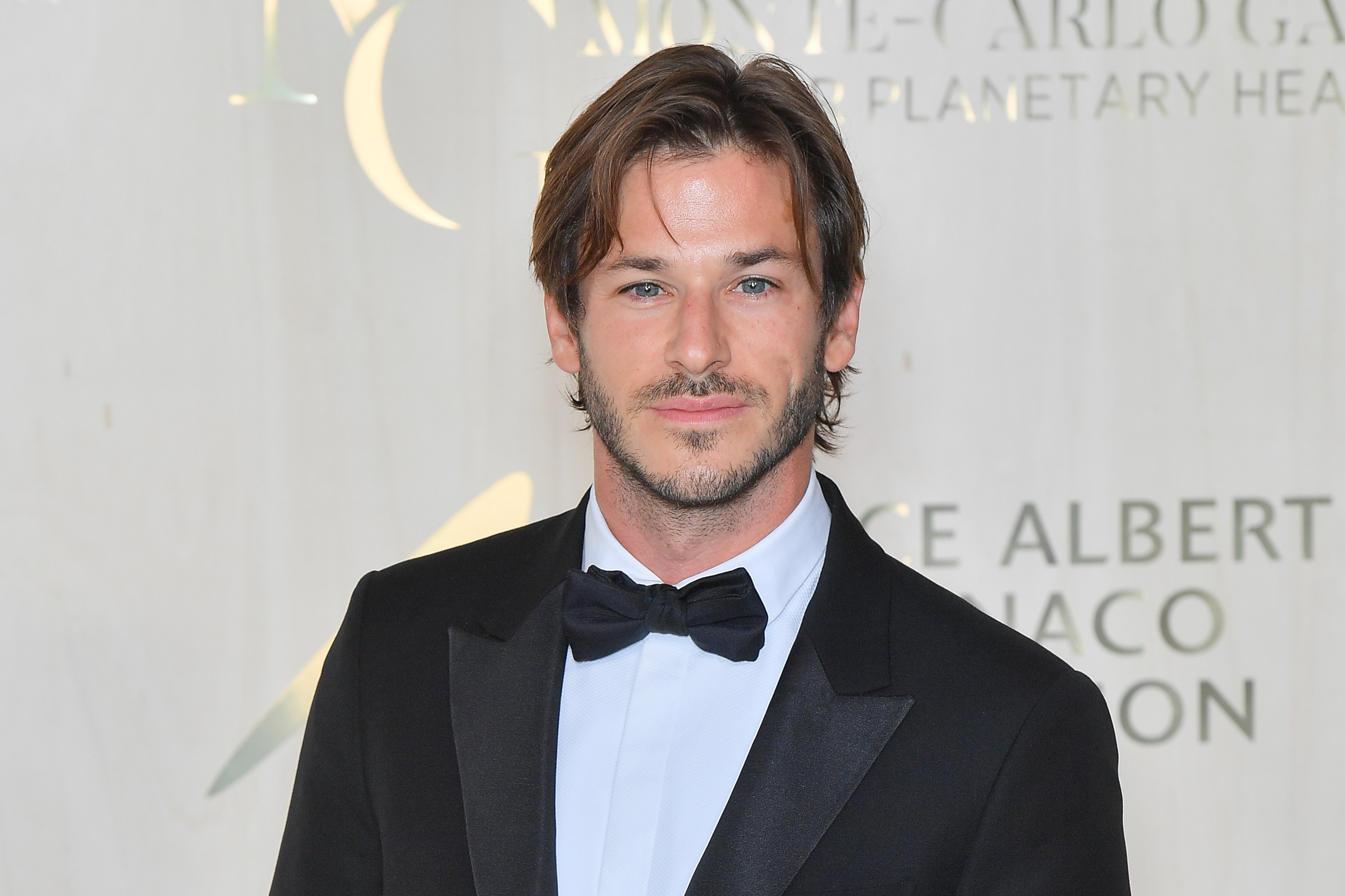 Gaspard Ulliel dressed in a tuxedo at a photocall during the 5th Monte-Carlo Gala
