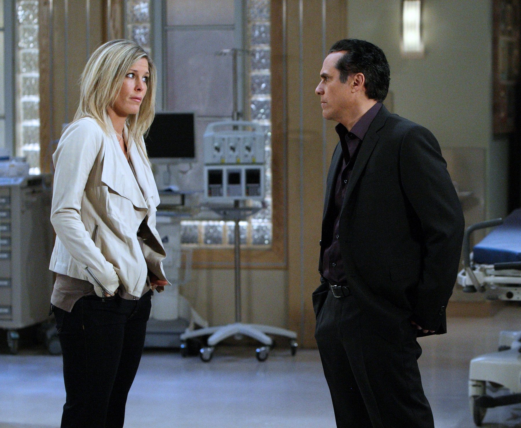 General Hospital speculation focuses on Carly, pictured here in a white jacket and black pants, and Sonny, pictured here in a black suit