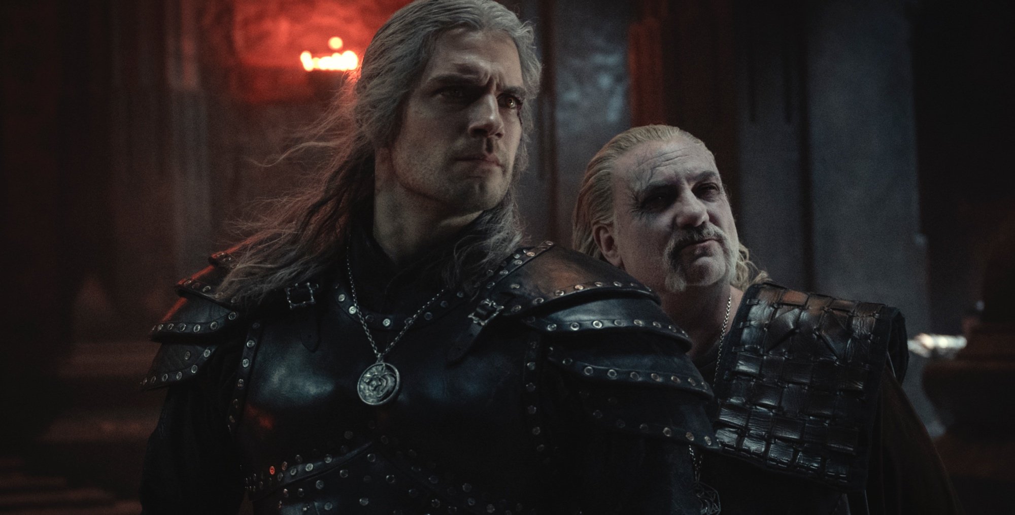 Geralt and Vesemir in 'The Witcher' Season 2 finale wearing medallions and armor.