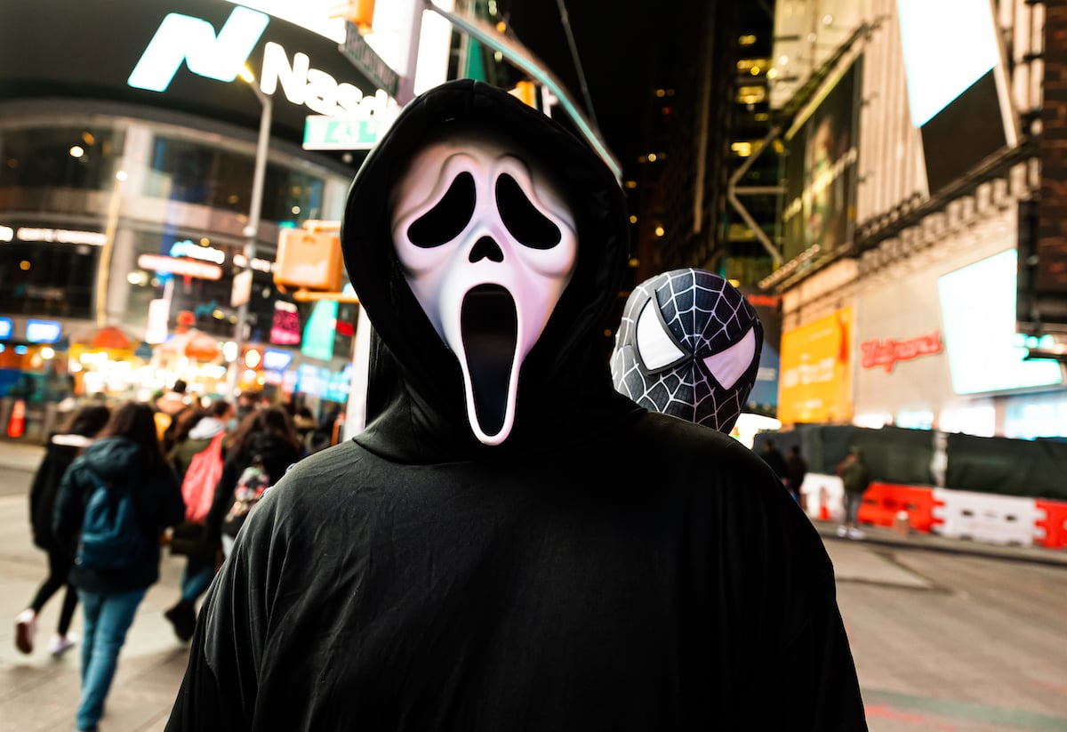 A person wears a Ghostface costume from the movie 'Scream' in Times Square