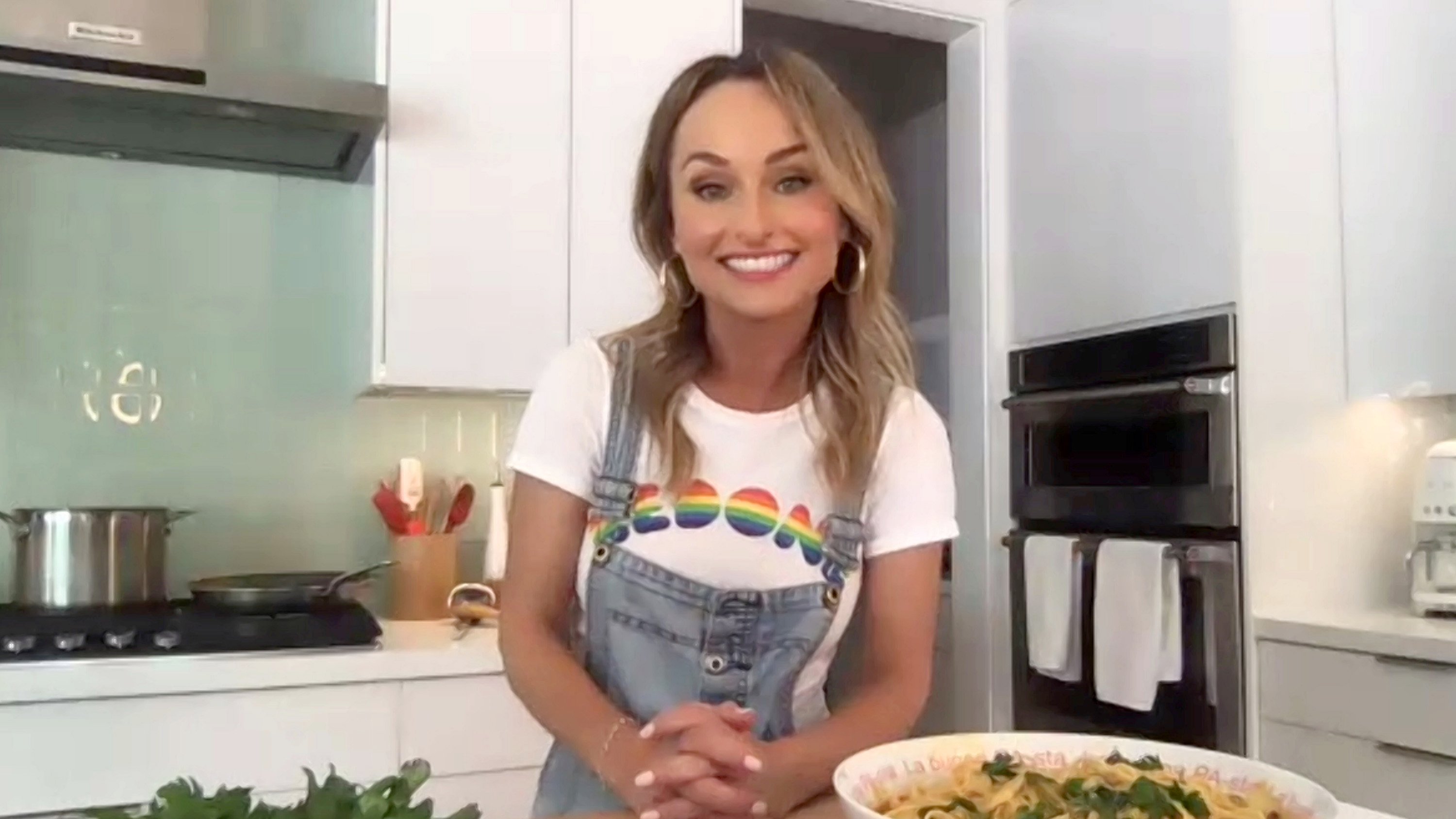 Celebrity chef Giada De Laurentiis appears in denim overalls and a T-shirt during a 2020 virtual Food Network event.