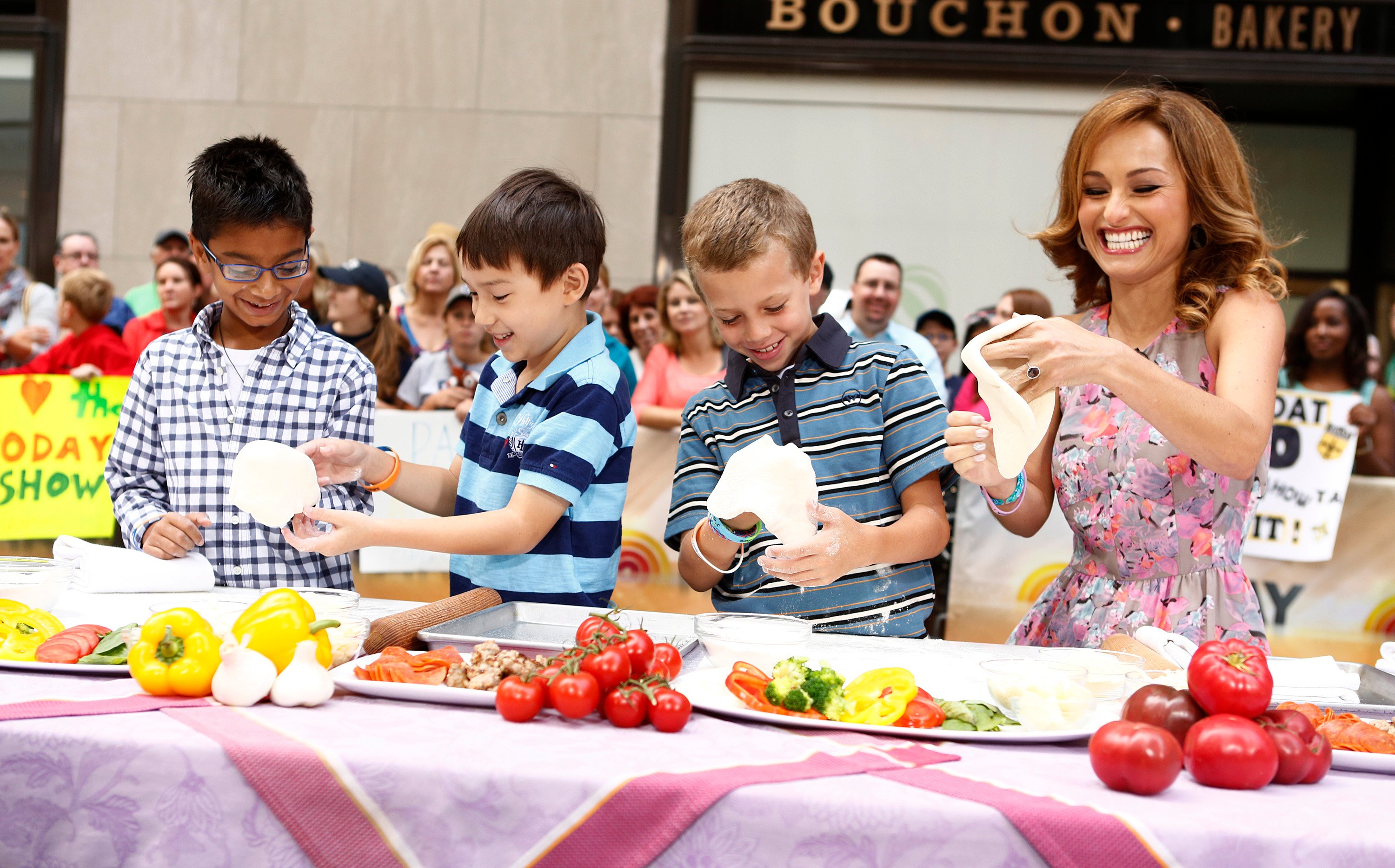 Chef Giada De Laurentiis makes pizza dough with three youngsters in a 2013 appearance on the 'Today Show' plaza.