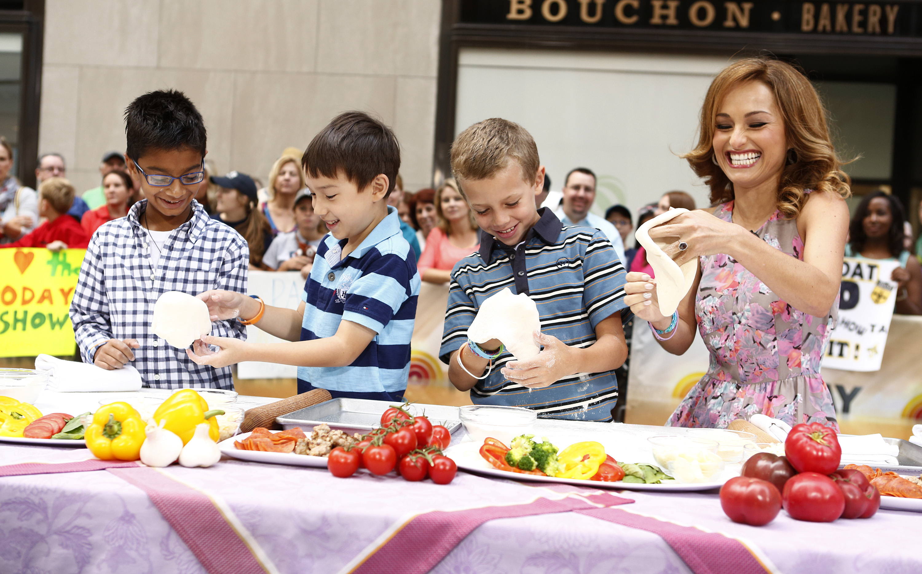 Chef Giada De Laurentiis makes pizza dough with three youngsters in a 2013 appearance on the 'Today Show' plaza.