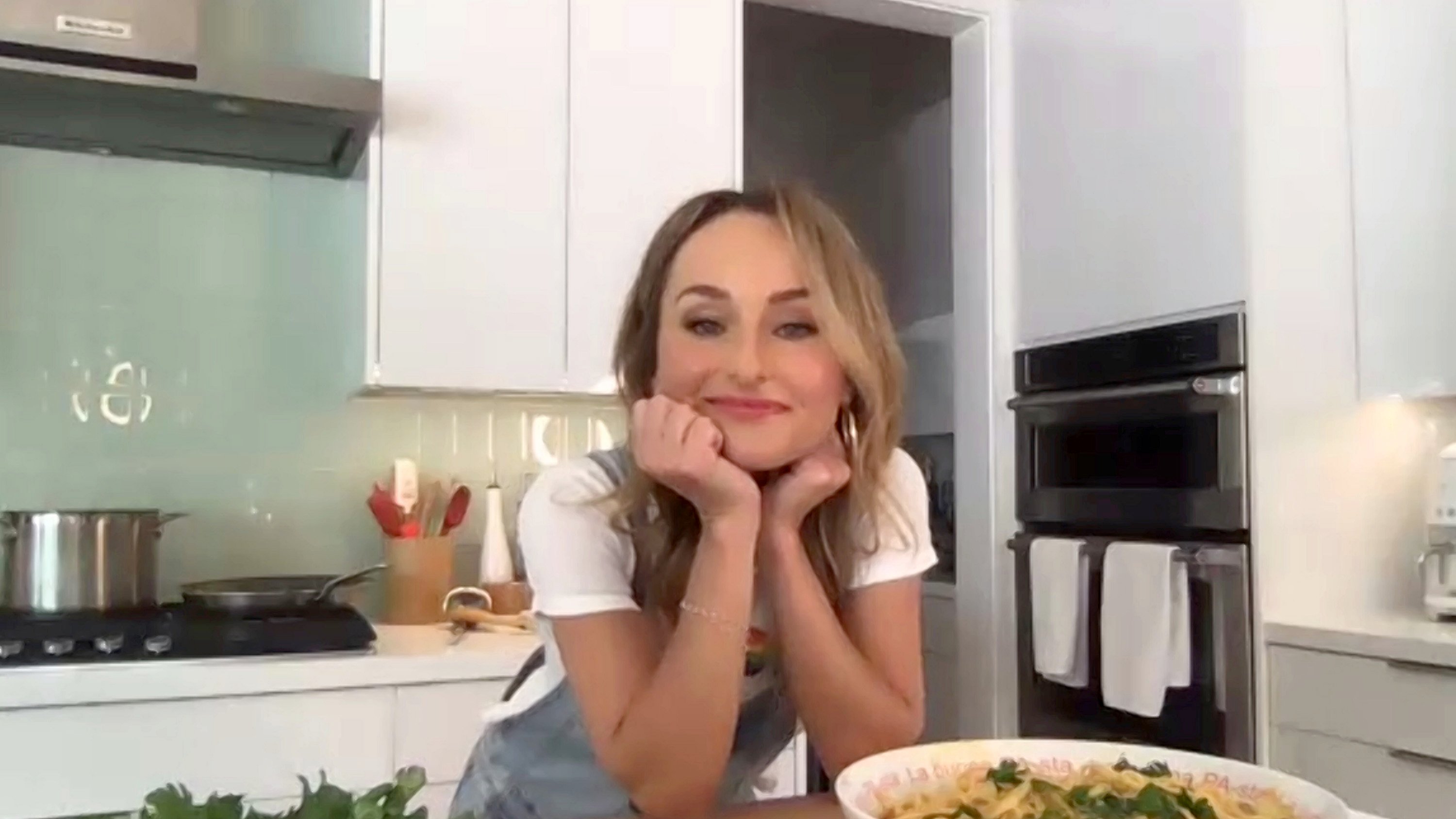 Food Network chef Giada De Laurentiis wears denim coveralls and a T-shirt during a 2020 virtual Food Network event.