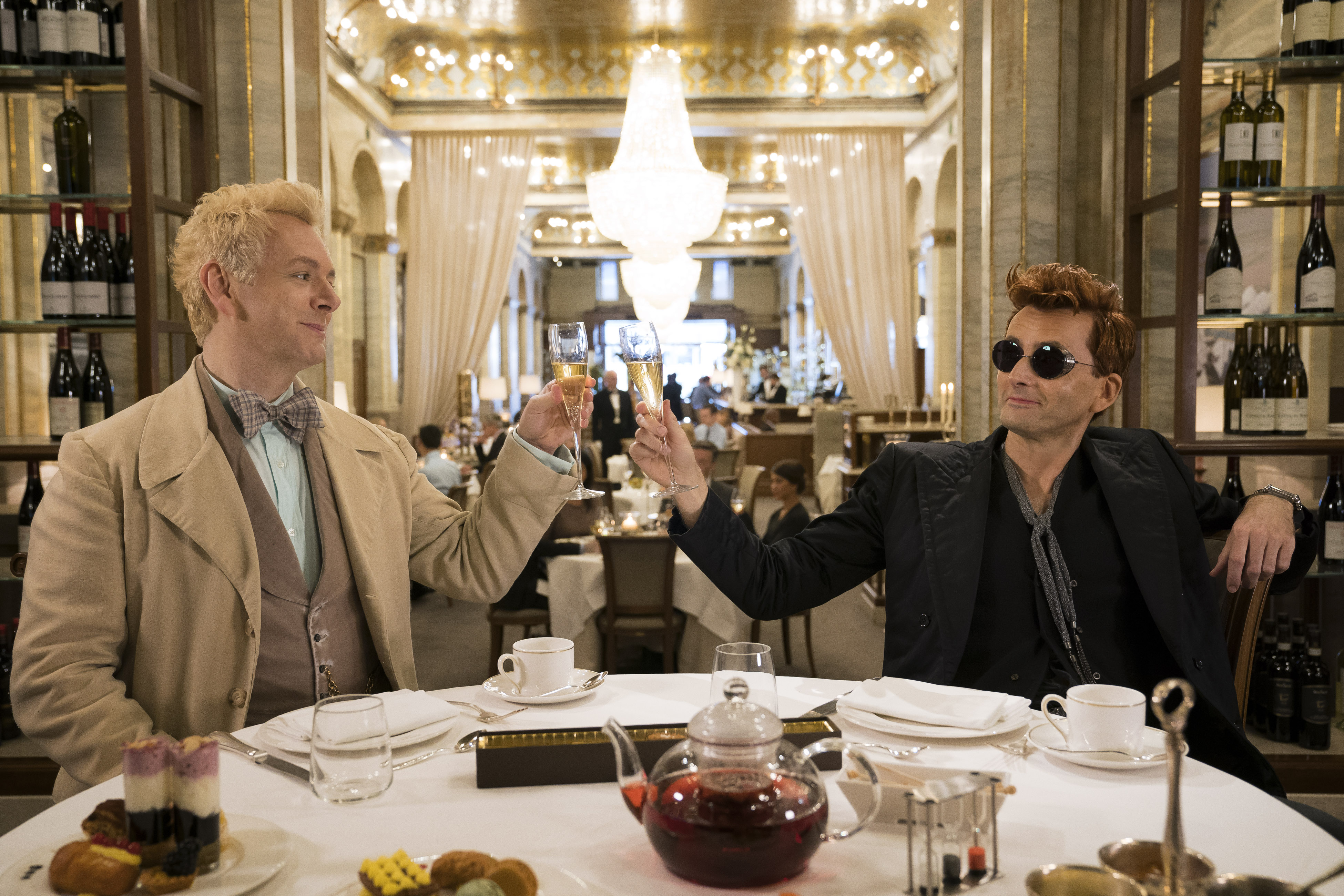 Michael Sheen in a white suit and David Tennant in a black suit in 'Good Omens' 