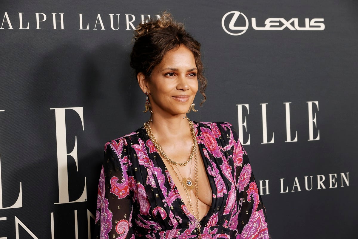 Halle Berry smiling in a pink dress.