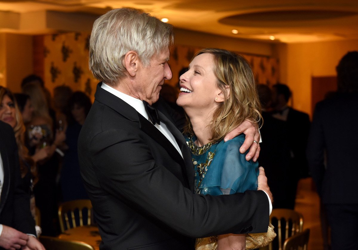 Actors Harrison Ford and Calista Flockhart hug at a 2016 Golden Globe Awards After Party