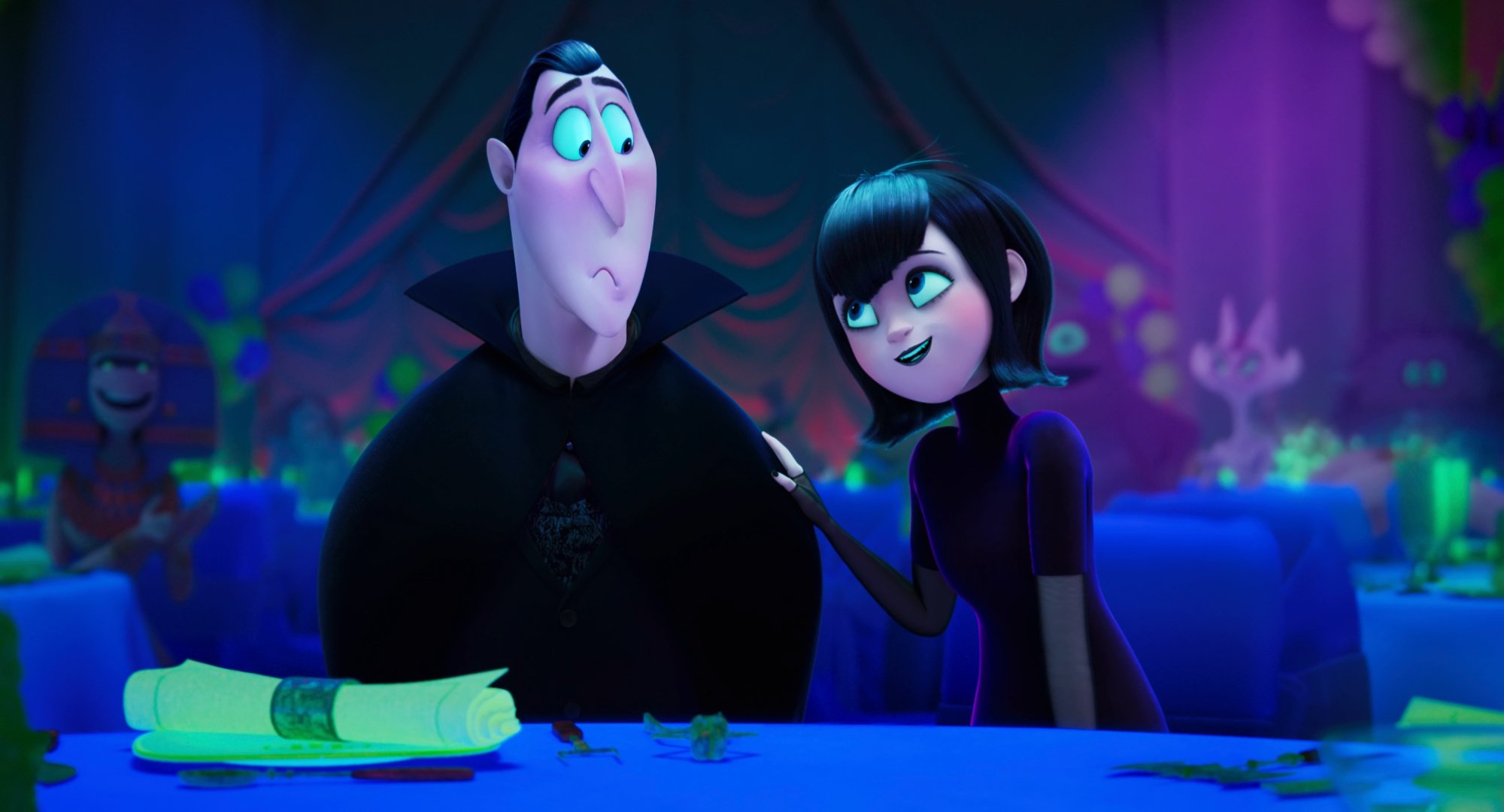 'Hotel Transylvania: Transformania' review Dracula voiced by Brian Hull and Mavis voiced by Selena Gomez sitting at table with Mavis' hand on Dracula's shoulder