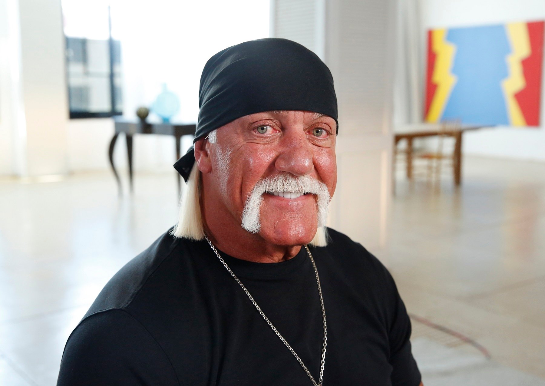 Hulk Hogan, pictured here in a black T-shirt and black bandana