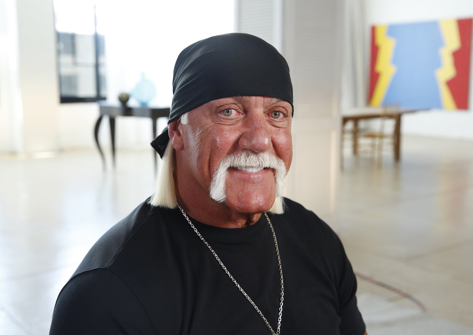 Hulk Hogan, pictured here in a black T-shirt and black bandana