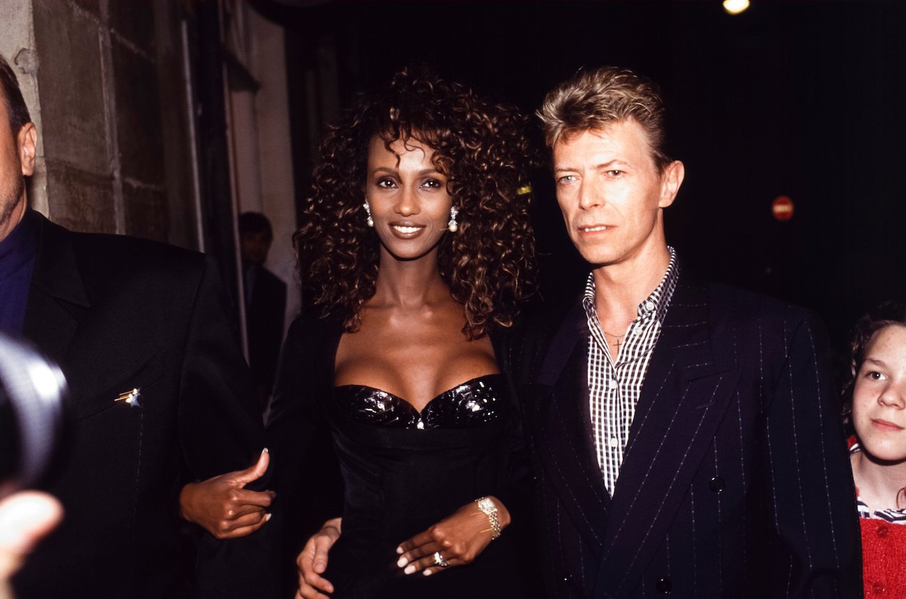 Iman and David Bowie out at night in Paris, France, 1991.