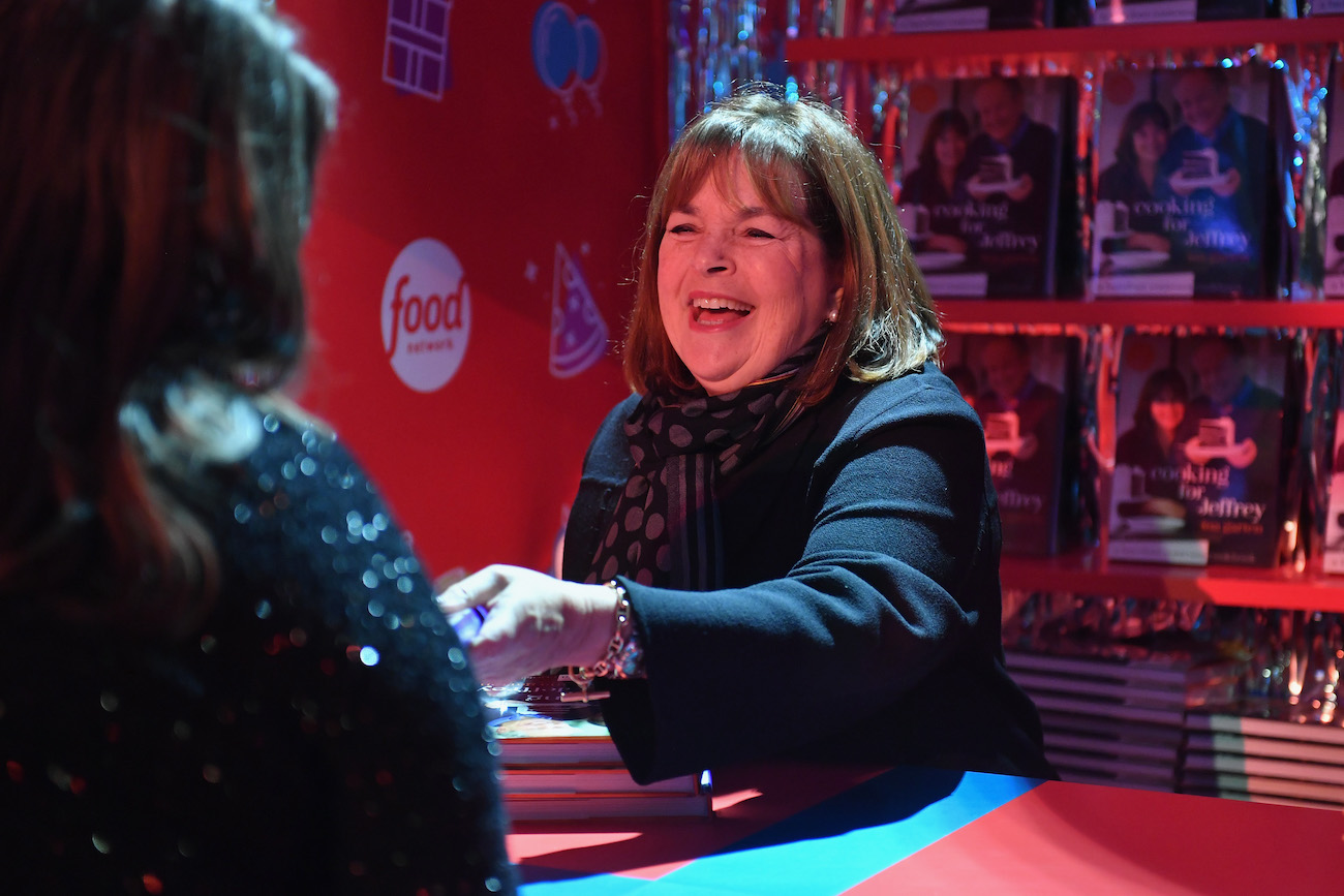 Ina Garten smiles as she speaks to a fan at Food Network's birthday party