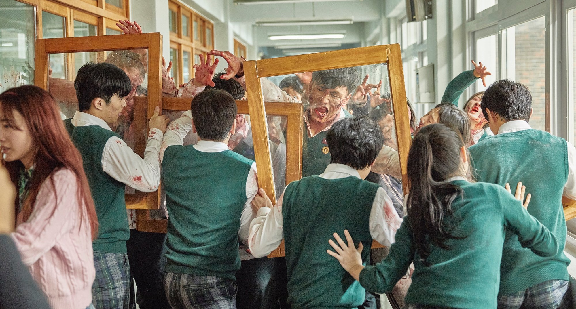 Infected students with virus in 'All of Us Are Dead' fighting against main characters.